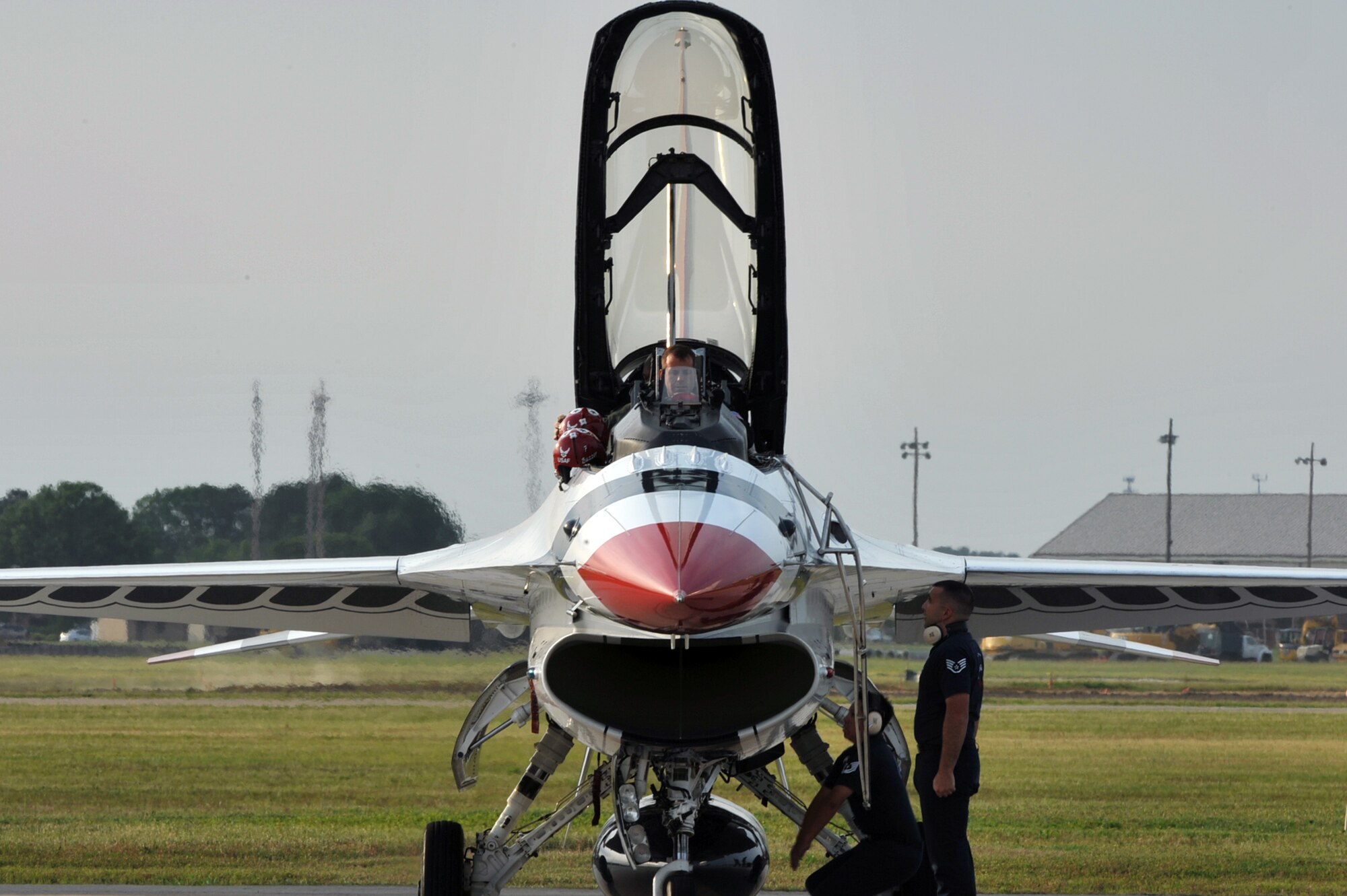 Lt. Col. Jason Koltes, Air Force Thunderbirds Premier Demonstration Team operations officer, and Travis Daniels, emergency medical technician, arrive at Langley Air Force Base, Va., May 12, 2011. The Thunderbirds selected Travis Daniels as the AirPower over Hampton Roads Hometown Hero, for which they rewarded him with an orientation flight in an F-16 Fighting Falcon. (U.S. Air Force photo by Airman 1st Class Camilla Griffin /RELEASED)