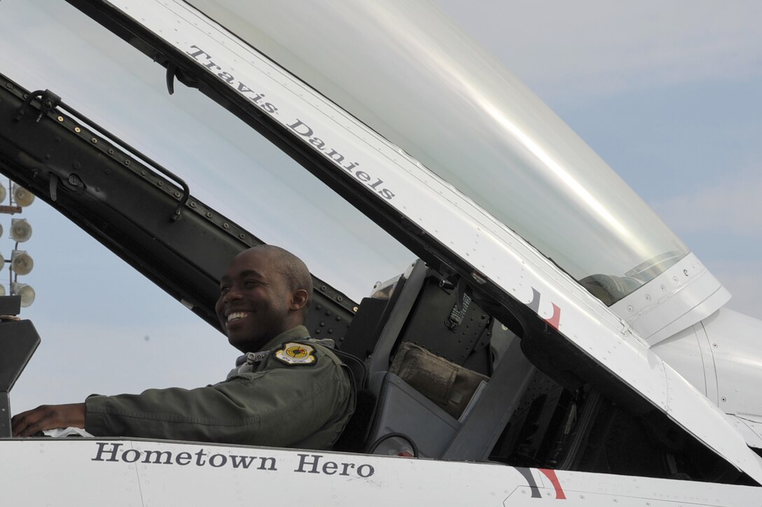 Travis Daniels, emergency medical technician, sits in the cockpit of a F-16 Fighting Falcon at Langley Air Force Base, Va., May 12, 2011. The Thunderbirds selected Mr. Daniels as the AirPower over Hampton Roads Hometown Hero, for which they rewarded him with an orientation flight in an F-16 Fighting Falcon. (U.S. Air Force photo by Airman 1st Class Camilla Griffin)(RELEASED)