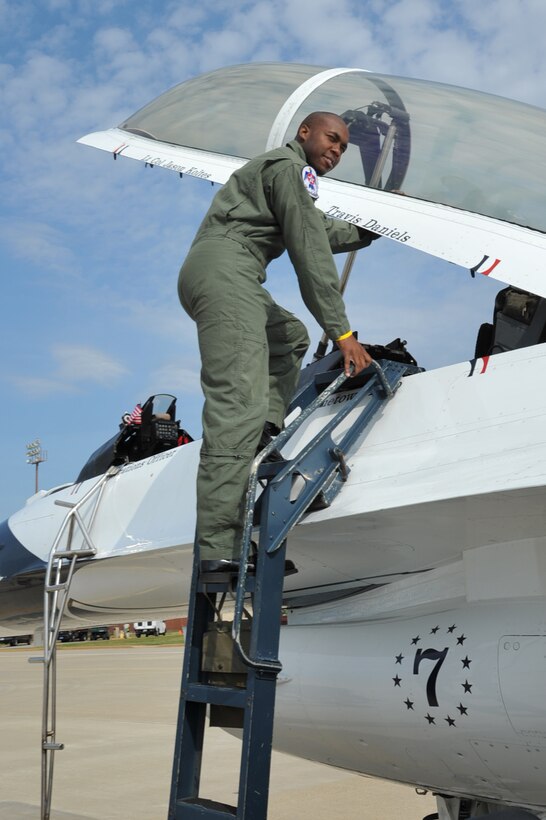 Travis Daniels, emergency medical technician, climbs the final step into an F-16 Fighting Falcon at Langley Air Force Base, Va., May 12, 2011. The Thunderbirds selected Mr. Daniels as the AirPower over Hampton Roads Hometown Hero, for which they rewarded him with an orientation flight in an F-16 Fighting Falcon. (U.S. Air Force photo by Airman 1st Class Camilla Griffin)(RELEASED)