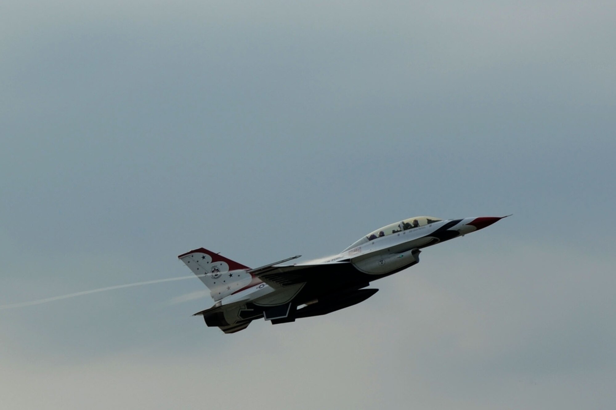 Lt. Col. Jason Koltes, Air Force Thunderbirds Premier Demonstration Team operations officer, and Travis Daniels, emergency medical technician, depart from Langley Air Force Base, Va., May 12, 2011. The Thunderbirds selected Travis Daniels as the AirPower over Hampton Roads Hometown Hero, for which they rewarded him with an orientation flight in an F-16 Fighting Falcon. (U.S. Air Force photo by Airman 1st Class Racheal Watson)(RELEASED)
