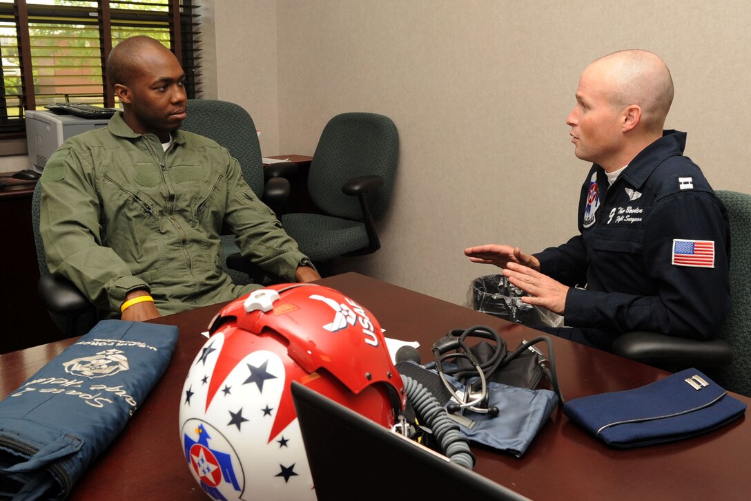 Capt. Thomas Bowden, Air Force Thunderbirds Premier Demonstration Team flight surgeon, conducts Mr. Travis Daniels, Medical Transport emergency medical technician, a basic health briefing at Langley Air Force Base, Va., May 12, 2011. The Thunderbirds selected Mr. Daniels as the AirPower over Hampton Roads Hometown Hero, for which they rewarded him with an orientation flight in an F-16 Fighting Falcon. (U.S. Air Force photo by Airman 1st Class Racheal Watson)(RELEASED)