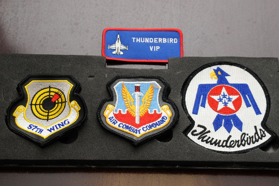 Thunderbird demonstration team patches rest on a table at Langley Air Force Base, Va., Base Operations May 12, 2011. The Thunderbirds selected Travis Daniels as the AirPower over Hampton Roads Hometown Hero, for which they rewarded him with an orientation flight in an F-16 Fighting Falcon. (U.S. Air Force photo by Airman 1st Class Racheal Watson)(RELEASED)