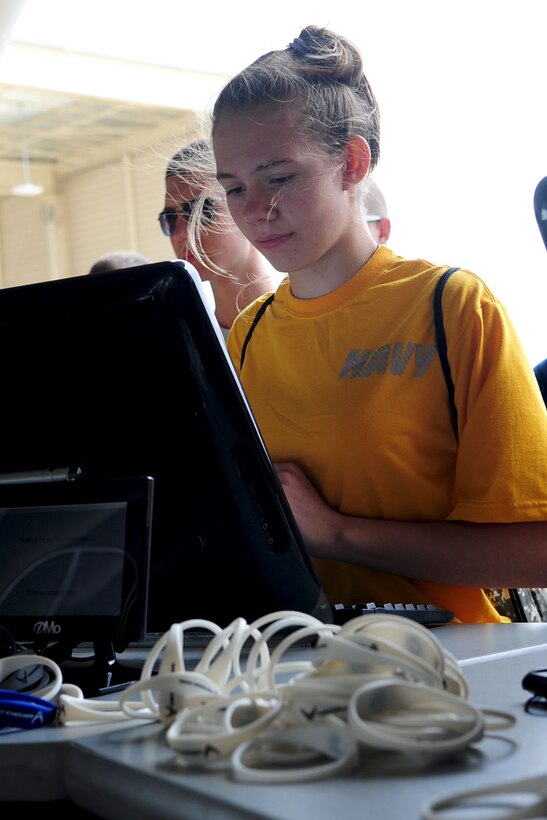 Cadet Jessica Torres, sixteen-year old with the Navy Junior Reserve Officer Training Corps from Gloucester High School, participates in an interactive targeting demonstration during the AirPower over Hampton Roads open house at Langley Air Force Base, Va., May 13, 2011. Joint Base Langley-Eustis’ open house helps to educate the public about Air Force capabilities, and shows appreciation to the local community. (U.S. Air Force photo by Staff Sgt. Ashley Hawkins)(RELEASED)