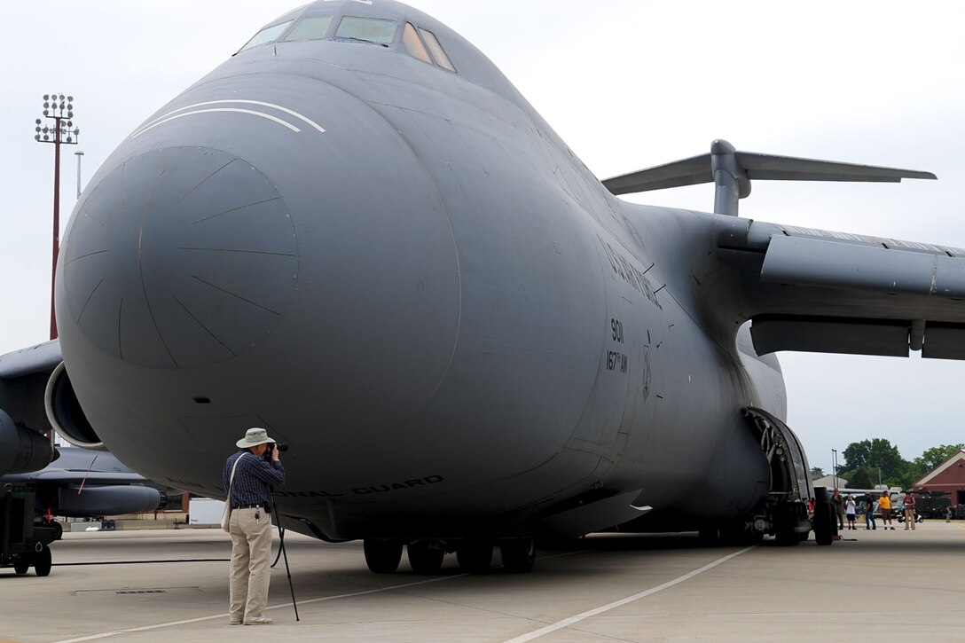 Norman Rictor takes photos of the aircraft on display during the AirPower over Hampton Roads open house at Langley Air Force Base, Va., May 13, 2011. The open house educates the public on past and present Air Force aerial capabilities, and increases recruiting. (U.S. Air Force photo by Staff Sgt. Ashley Hawkins)(RELEASED)