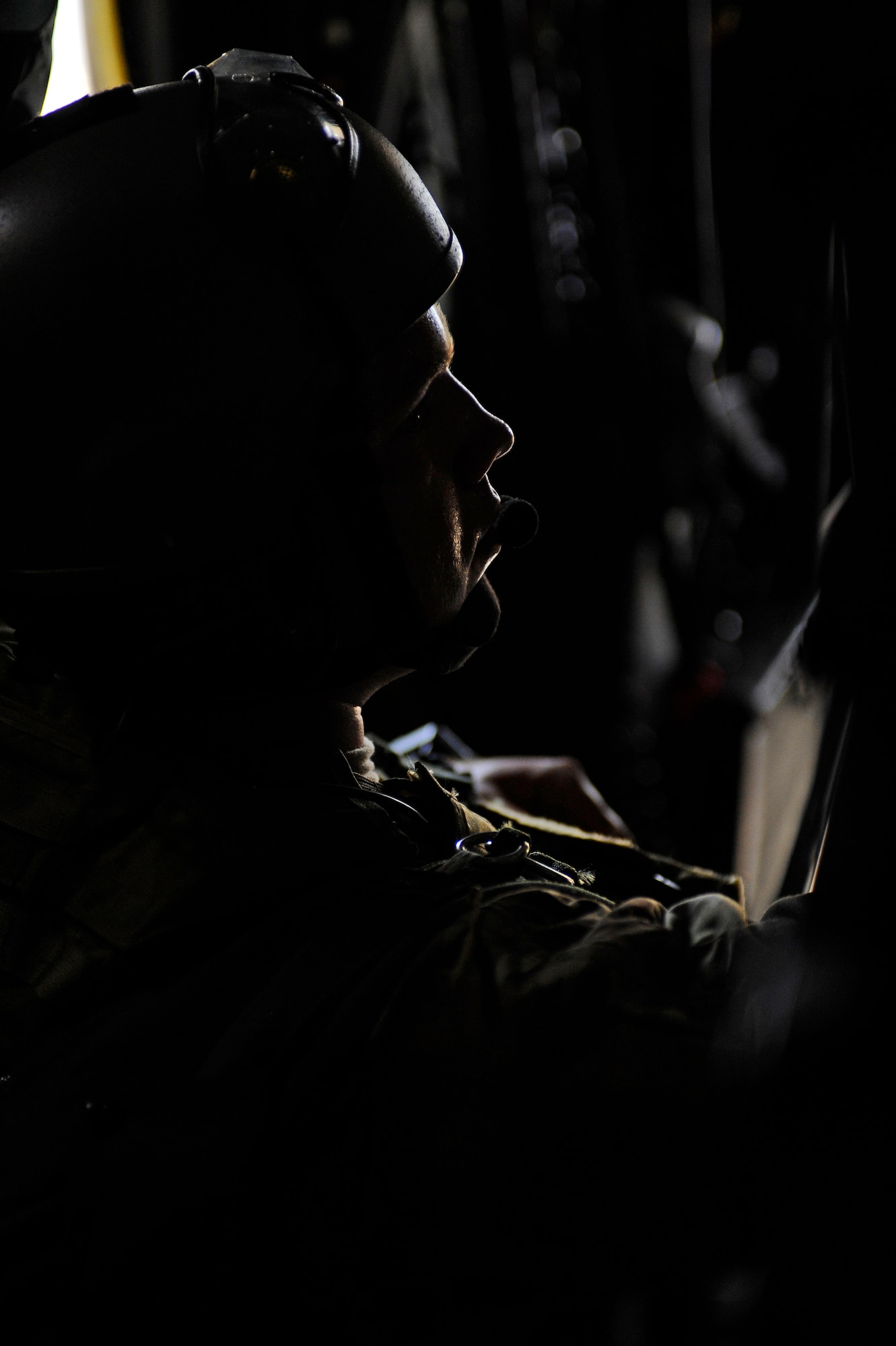 Tech. Sgt. Matthew Canoy, 720th Operations Support Squadron, sits on a 9th Special Operations Squadron MC-130P before parachuting into a simulated disaster area, Field 6, Eglin Air Force Base range, Fla., May 11, 2011. Operation Nimble Response is an exercise to hone humanitarian and disaster relief efforts. Close to 50 personnel from Head Quarters Air Force Special Operations Command, 1st Special Operations Wing, and 280th Combat Communications Squadron, in coordination with USAID, worked together to improve disaster response. (U.S. Air Force photo by Staff Sgt. Julianne M. Showalter/Released)
