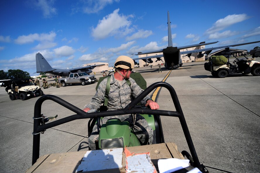 Staff Sgt. Charles Daum, 280th Combat Communications Squadron, backs up an All Terrain Vehicle onto a 9th Special Operations Squadron MC-130P, Hurlburt Field, Fla., May 11, 2011. Operation Nimble Response is an exercise to hone humanitarian and disaster relief efforts. Close to 50 personnel from Head Quarters Air Force Special Operations Command, 1st Special Operations Wing, and 280th Combat Communications Squadron, in coordination with USAID, worked together to improve disaster response. (U.S. Air Force photo by Staff Sgt. Julianne M. Showalter/Released)