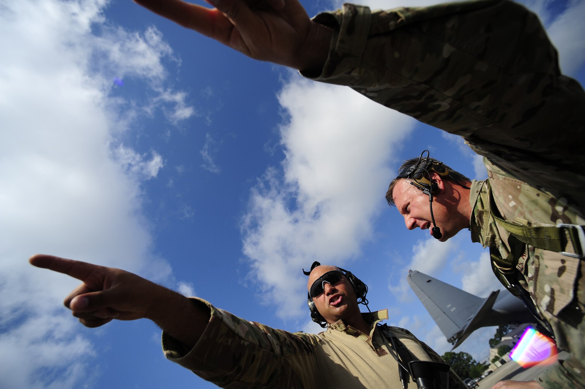 Tech. Sgt. Jose Garza and Master Sgt. Brian Jacobi, 720th Operations Support Squadron, discuss the load plan for equipment on a 9th Special Operations Squadron MC-130P, Hurlburt Field, Fla., May 11, 2011. Operation Nimble Response is an exercise to hone humanitarian and disaster relief efforts. Close to 50 personnel from Head Quarters Air Force Special Operations Command, 1st Special Operations Wing, and 280th Combat Communications Squadron, in coordination with USAID, worked together to improve disaster response. (U.S. Air Force photo by Staff Sgt. Julianne M. Showalter/Released)