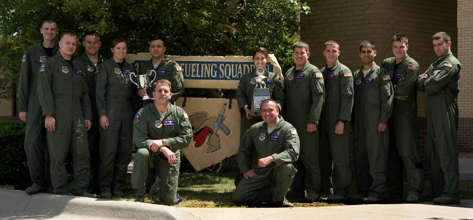 The 349th Air Refueling Squadron poses for a photo with their 2008 and 2010 General Carl A. Spaatz Trophies, May 5, 2011, McConnell Air Force Base, Kan. The Spaatz Trophy recognizes the best of the best in air refueling Air Force-wide. In 2008 the 349th ARS won the trophy. It was presented to them again for 2010. (U.S. Air Force photo/Airman 1st Class Armando A. Schwier-Morales) 