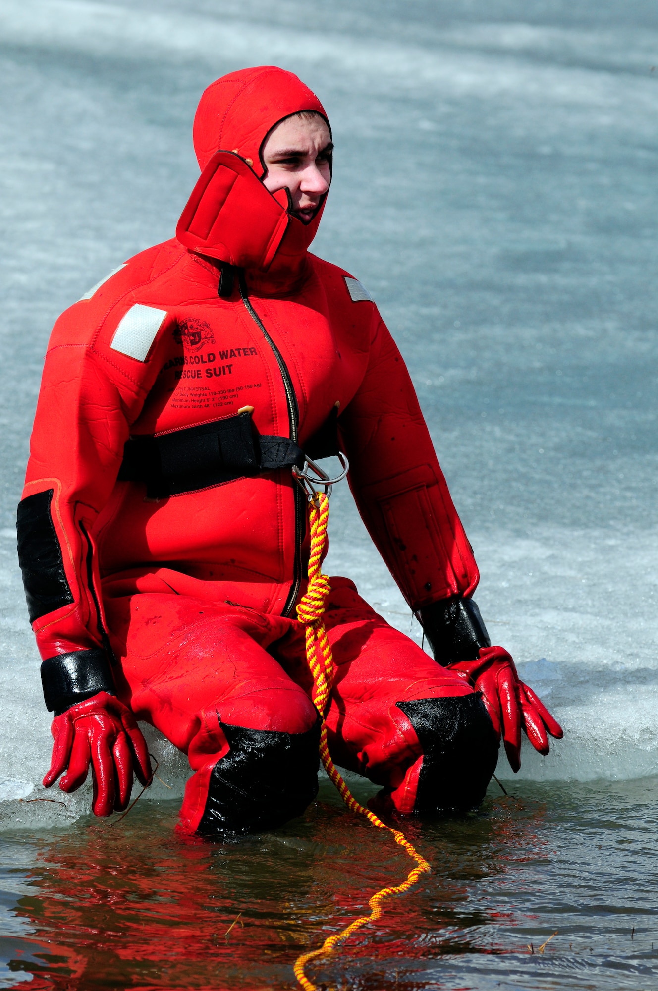 Staff Sgt. Eric Brownsell gets his feet wet before jumping into an icy lake during ice water rescue training May 6, 2011, Eielson Air Force Base, Alaska. Emergency rescue Airmen train to stay prepared in the event of an emergency since Alaska lakes are frozen nine to 10 months of the year. Sergeant Brownsell is assigned to the 354th Civil Engineer Squadron Fire Protection Flight. (U.S. Air Force photo/Airman 1st Class Laura Goodgame)