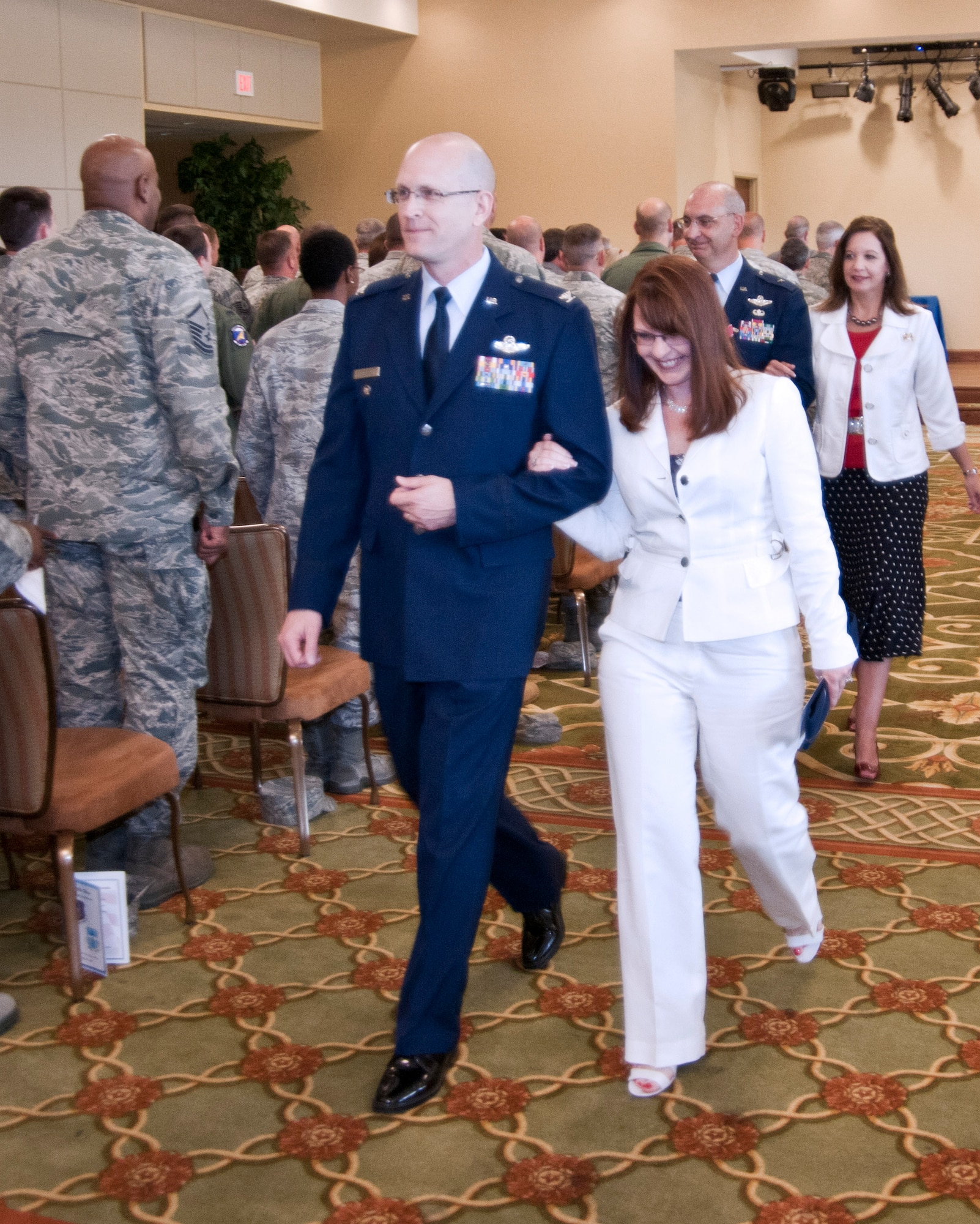 Colonel Jensen and his wife Chantel leave together after the 403rd Wing change of command ceremony May 12 at the Bay Breeze Event Center.  (U.S. Air Force photo by Tech. Sgt. Tanya King)