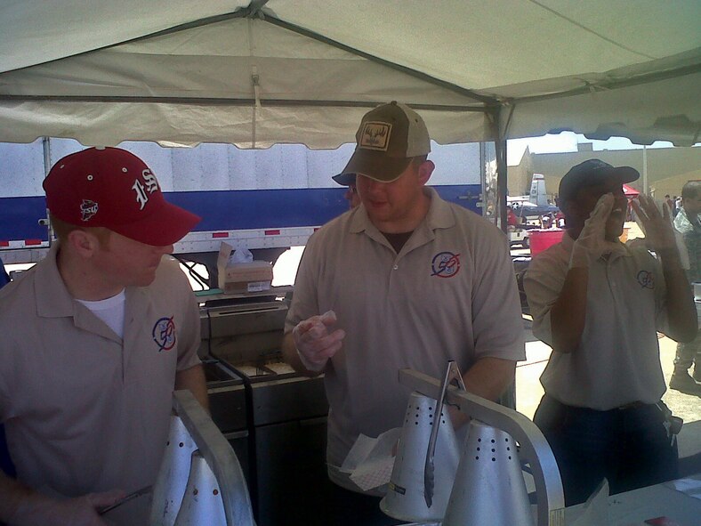 Many Airmen around base, like members of Team 5/6, volunteered their time at food booths to help make the 2011 Defenders of Liberty Air Show experience more enjoyable for guests at Barksdale Air Force Base, La., May 7-8. (courtesy photo by Tech. Sgt. Deborah Frazier, Air Force Global Strike Command Civil Law, NCO-in-charge)
