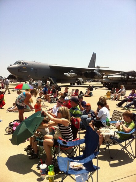 Spectators at the 2011 Defenders of Liberty Air Show at Barksdale Air Force Base, La., set up chairs and umbrellas around or under static aircraft in order to enjoy the aerial demonstrations throughout the day. (courtesy photo by Mr. Doug Maiden, 2nd Civil Engineer Squadron)