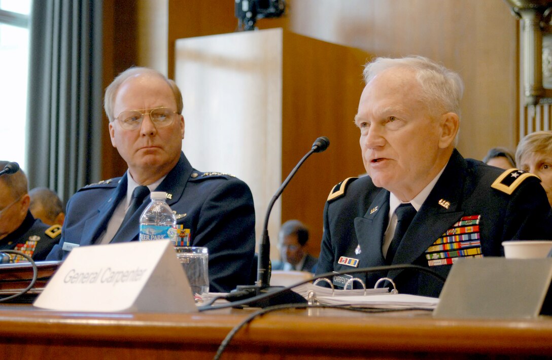 Army Maj. Gen. Raymond Carpenter, the acting director of the Army National Guard, talks about the Army Guard as an operational force during a Senate Appropriations Committee hearing May 11, 2011, in Washington D.C.. Air Force Gen. Craig McKinley (left), the chief of the National Guard Bureau, and Air Force Lt. Gen. Harry Wyatt, the director of the Air National Guard, also talked about how far the Air Guard and the National Guard have come since 9/11. (U.S. Army photo/Sgt. Darron Salzer)