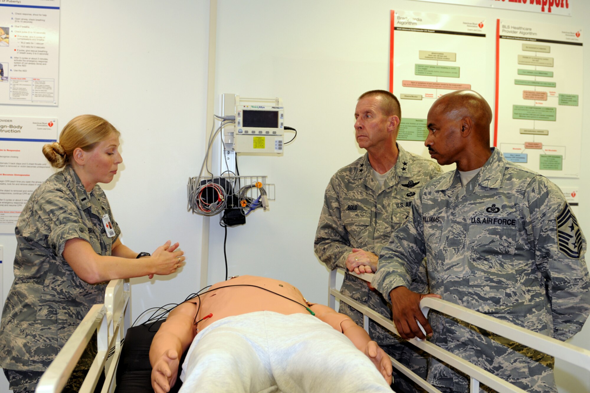 First Lt. Emily Brakora, 14th Medical Operations Squadron clinical nurse shows off a simulation dummy to Maj. Gen. Mark Solo, 19th Air Force commander and 19th Air Force Command Chief Master Sgt. Michael Williams. The 19th AF leadership visited Columbus Air Force Base May 10 and 11 to see the 14th Flying Training Wing firsthand. (U.S. Air Force photo/Elizabeth Owens). 