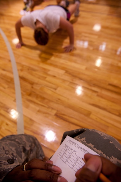 A push-up counter writes down the amount of push-ups completed during Moody’s First Sergeants push-up challenge at Moody Air Force Base, Ga. May 13. Each team was allowed to execute their own strategy to perform as many push-ups as possible within a ten-minute time limit. (U.S. Air Force photo/ Airman 1st Class Joshua Green)(RELEASED)
