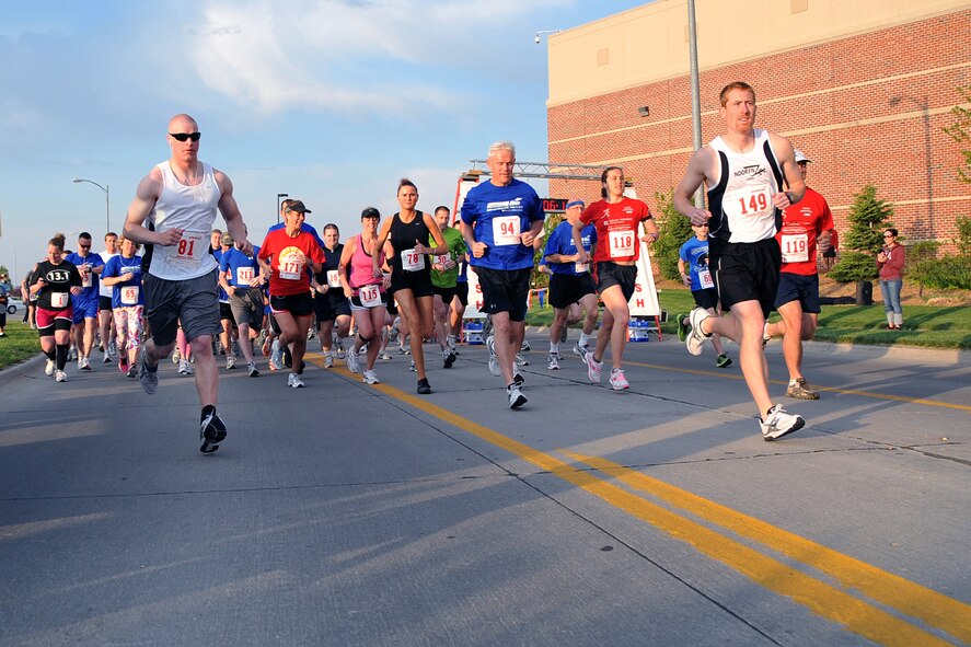 OFFUTT AIR FORCE BASE, Neb. -- Runners start strong at the 4th Annual Bellevue-Offutt Runway Run May 8. Nearly 200 runners of all ages came to Bellevue to compete in the seven mile race.