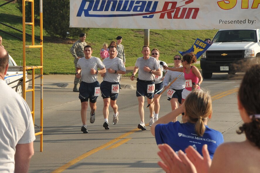 OFFUTT AIR FORCE BASE, Neb. -- Members of the the 55th Security Forces Squadron finish strong while staying in cadence for the 4th Annual Bellevue-Offutt Runway Run May 8. Nearly 200 runners of all ages came to Bellevue to compete in the seven mile race.