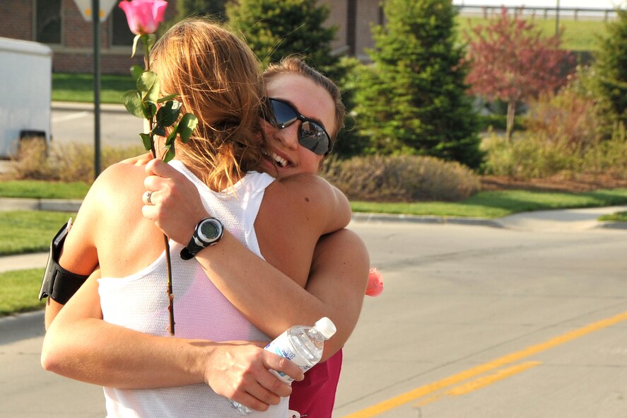 OFFUTT AIR FORCE BASE, Neb. --Alma Royser, wife of 1st Lt. Aaron Royser from the 45th Reconnaisance Squadron, smiles as she hugs her sisterafter finishing the 4th Annual Bellevue-Offutt Runway Run May 8. Nearly 200 runners of all ages came to Bellevue to compete in the seven mile race.