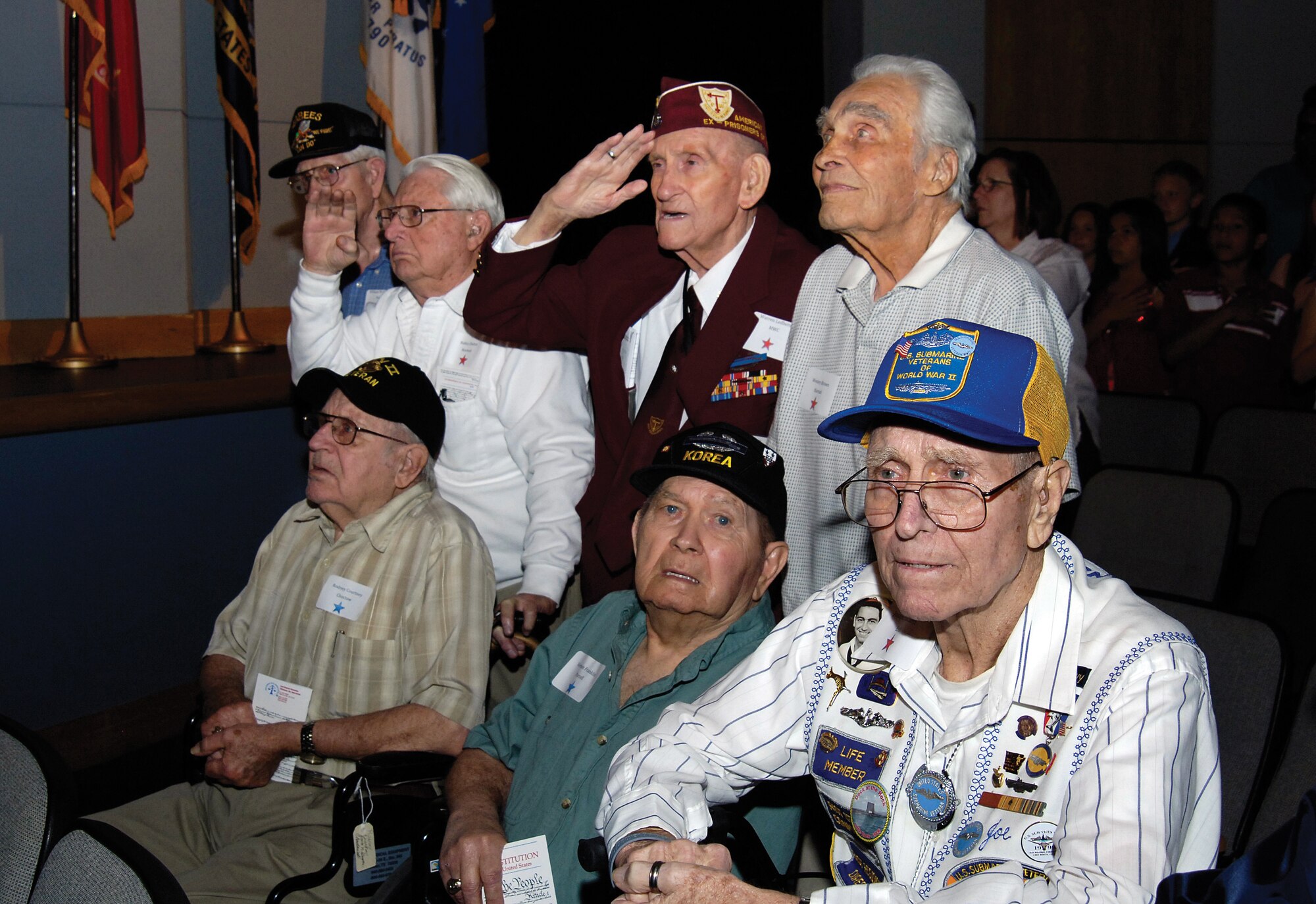 During the May 3 Oklahoma Honor Flights program at Rose State College, six Junior ROTC cadets recite the oath of office administered to them by World War II veteran Frank Mahan. A symbolic passing of the baton from the World War II veterans to the cadets, showed the high school students’ commitment to serving their country once they graduate. The 97 Oklahoma veterans honored during the program left the next morning on a trip to the World War II Memorial in Washington, D.C.