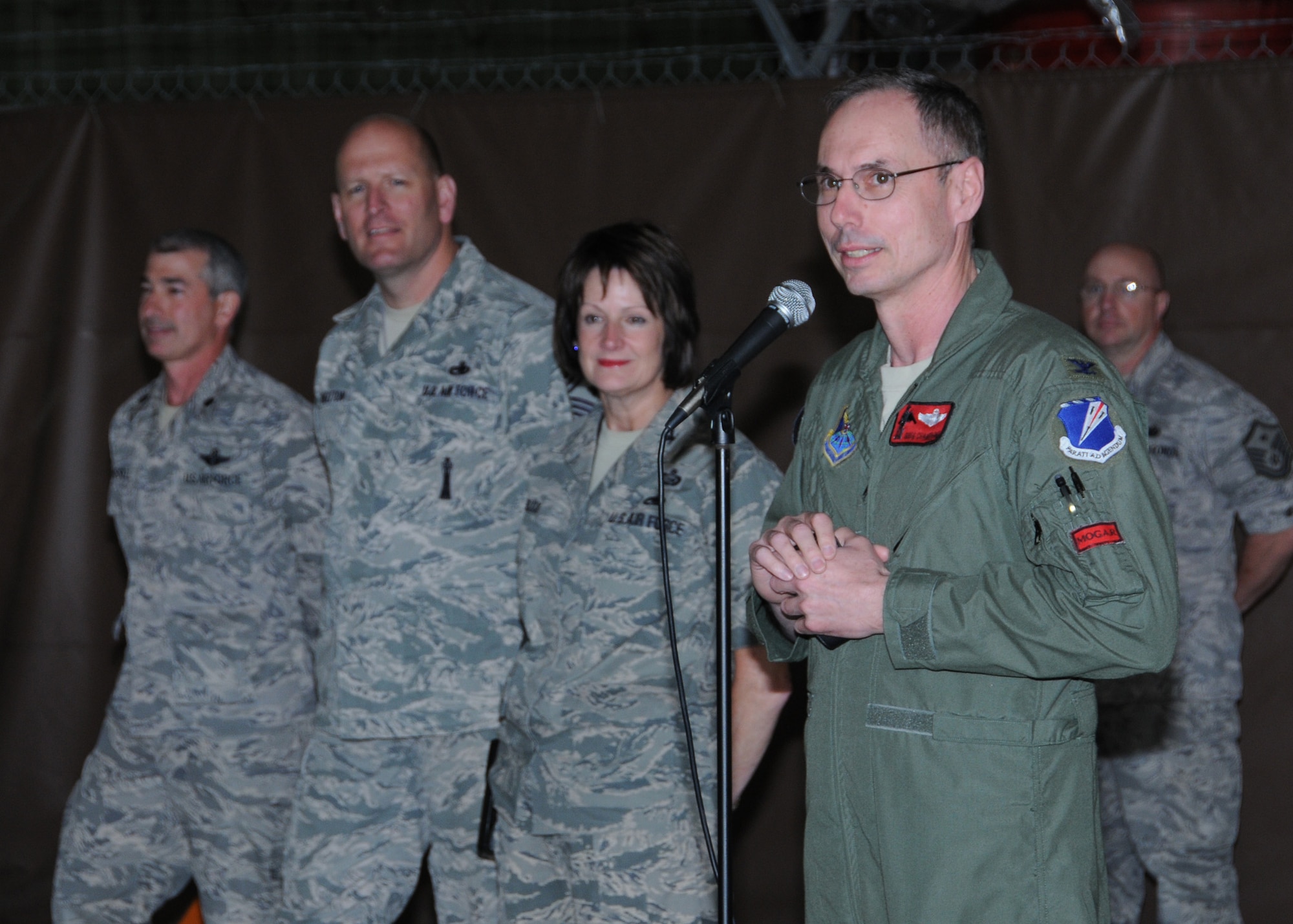 Col. Greg Champagne, 131st Bomb Wing commander, addresses Lambert Air National Guard personnel after base wide tornado clean-up efforts during drill weekend, May 1.   A category EF4 tornado swept through Lambert Field, the South Side of Lambert Air National Guard Base, and several of the surrounding cities, April 22.  Damage estimates for the Lambert base are $10.5 million (U.S.)   (Photo by Master Sgt. Mary-Dale Amison)