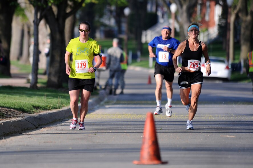 OFFUTT AIR FORCE BASE, Neb. -- Runners move into the final leg of the the 4th Annual Bellevue-Offutt Runway Run held May 8. Nearly 200 runners of all ages came to Bellevue to compete. U.S. Air Force Photo by Josh Plueger (released)