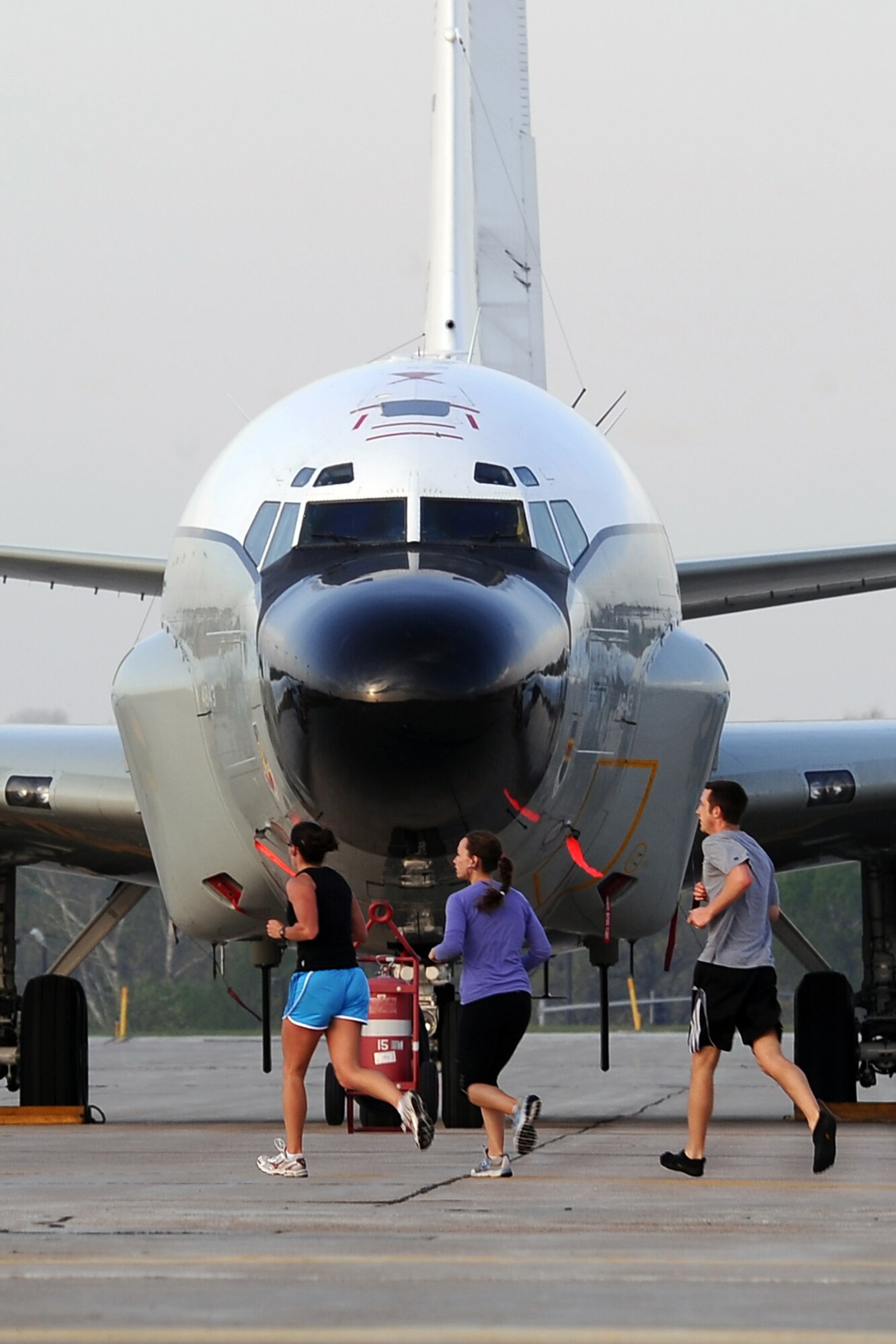 OFFUTT AIR FORCE BASE, Neb. - Runners pass an RC-135 Rivet Joint while participating in the the 4th Annual Bellevue-Offutt Runway Run held May 8. Nearly 200 runners of all ages came to Bellevue to compete in the seven mile event. U.S. Air Force Photo by Josh Plueger (released)
