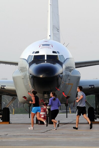 OFFUTT AIR FORCE BASE, Neb. - Runners pass an RC-135 Rivet Joint while participating in the the 4th Annual Bellevue-Offutt Runway Run held May 8. Nearly 200 runners of all ages came to Bellevue to compete in the seven mile event. U.S. Air Force Photo by Josh Plueger (released)

