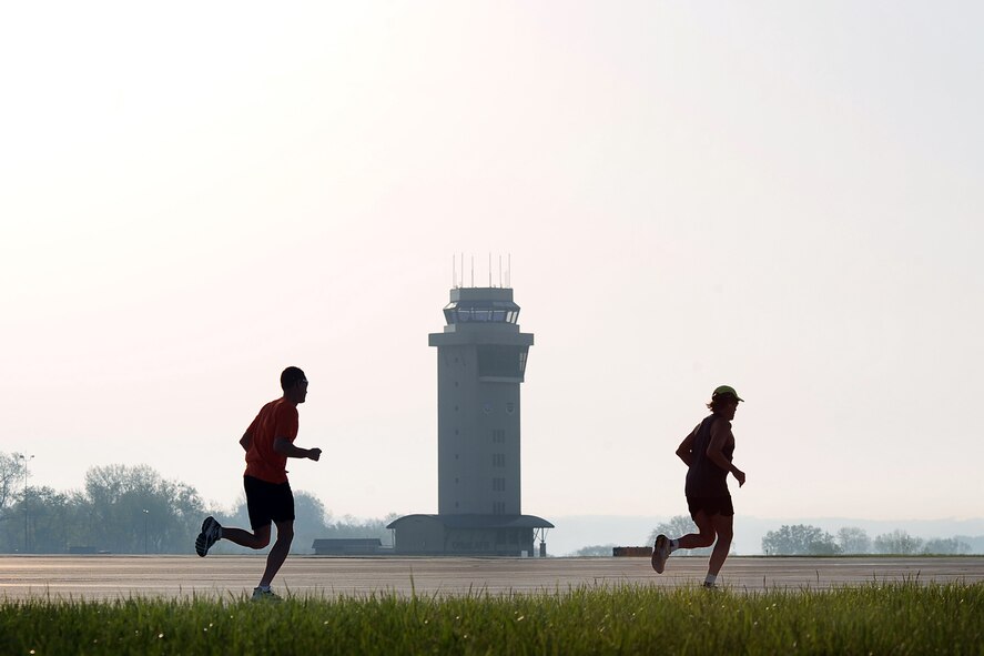OFFUTT AIR FORCE BASE, Neb. -- Runners pass the Offutt flight tower while participating in the the 4th Annual Bellevue-Offutt Runway Run May 8. Nearly 200 runners of all ages came to Bellevue to compete in the seven mile race.U.S. Air Force Photo by Josh Plueger