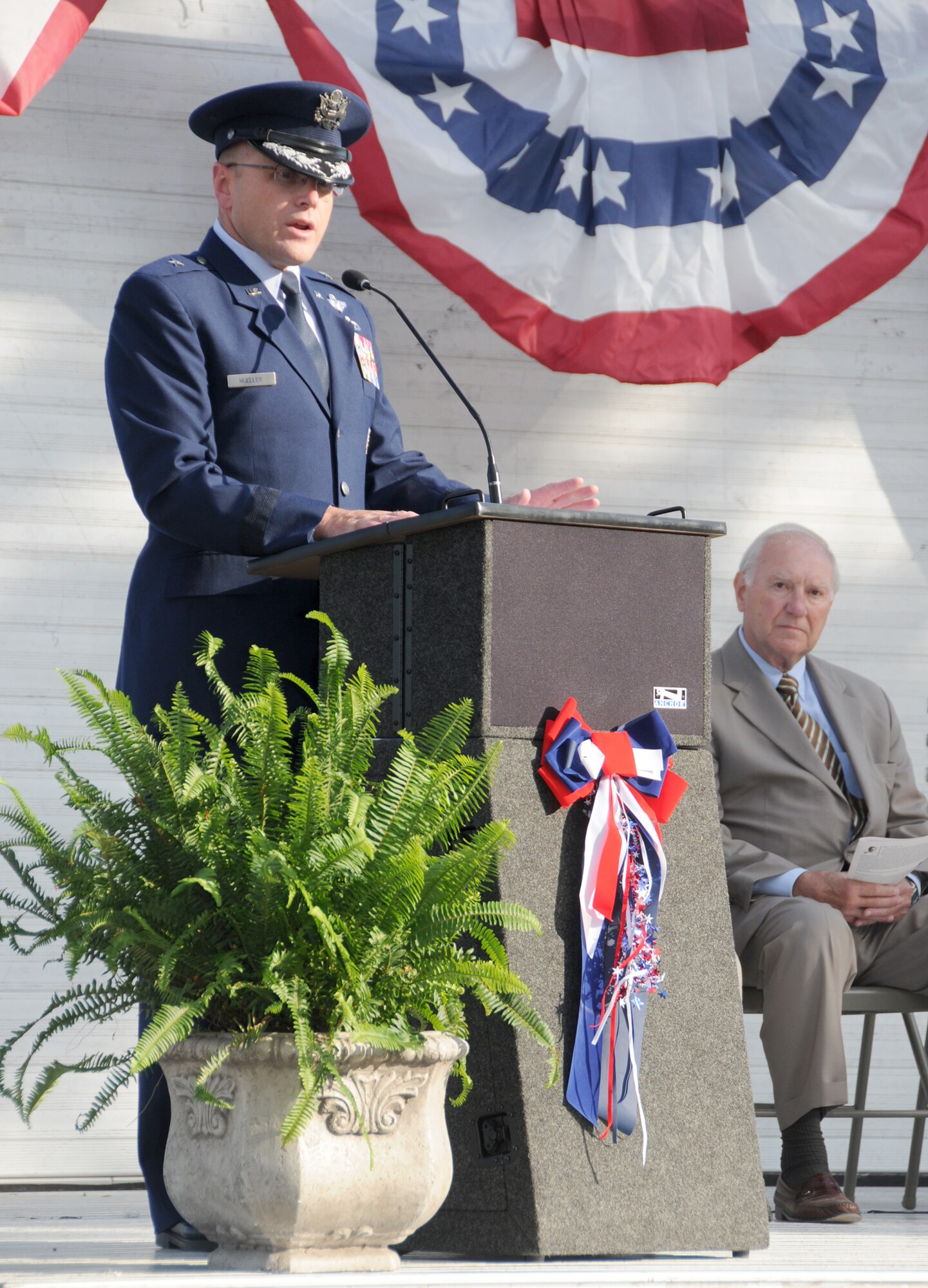Brig. Gen. Andrew Mueller, 81st Training Wing commander, addresses the audience at the City of Biloxi's celebration of its military history May 5 part of the city's Preservation in May series.  Biloxi Mayor A.J. Holloway is pictured at right.  (U.S. Air Force photo by Kemberly Groue)