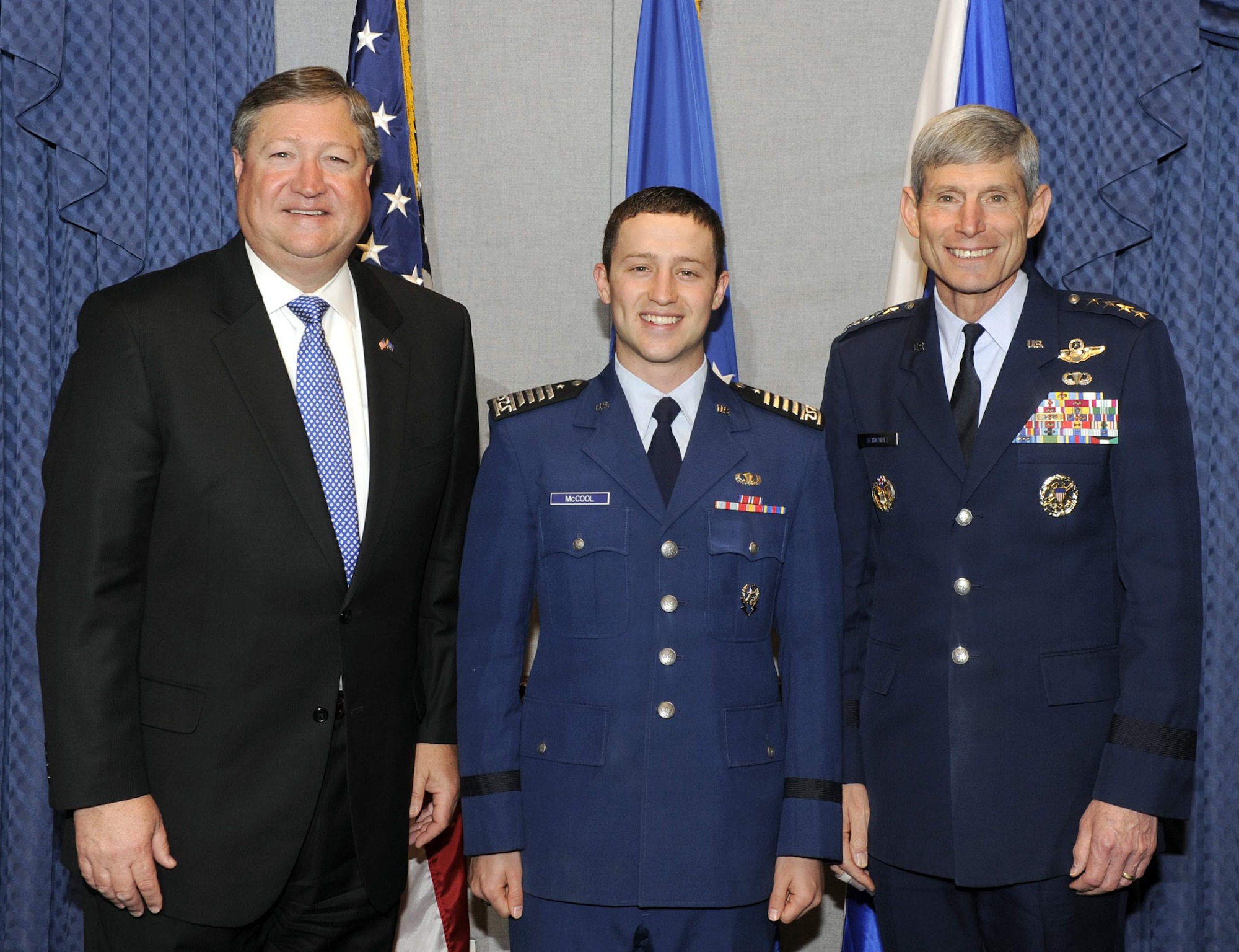 Secretary of the Air Force Michael Donley, Air Force Academy Cadet Christopher J. McCool and Air Force Chief of Staff Gen. Norton Schwartz stand for a photo during the 2010 U.S. Air Force Cadet of the Year ceremony May 12, 2011, at the Pentagon. Cadet McCool earned the honor for demonstrated excellence in military skill, academics and athletics in an Air Force commissioning program. (U.S. Air Force photo/Andy Morataya)