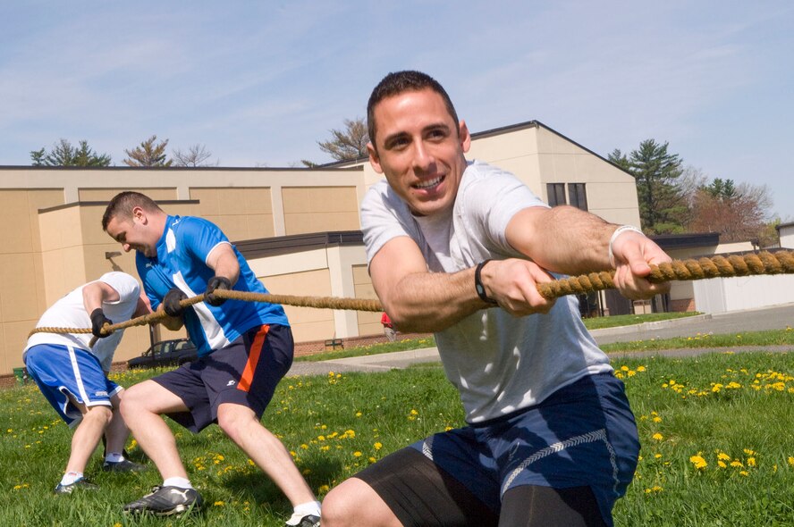 HANSCOM AIR FORCE BASE, Mass. – Senior Airman Richard Ruiz (right) and other members of the 66th Air Base Group team compete during the tug-of-war competition as part of the Hanscom Olympics on May 6. (U.S. Air Force photo by Mark Wyatt)