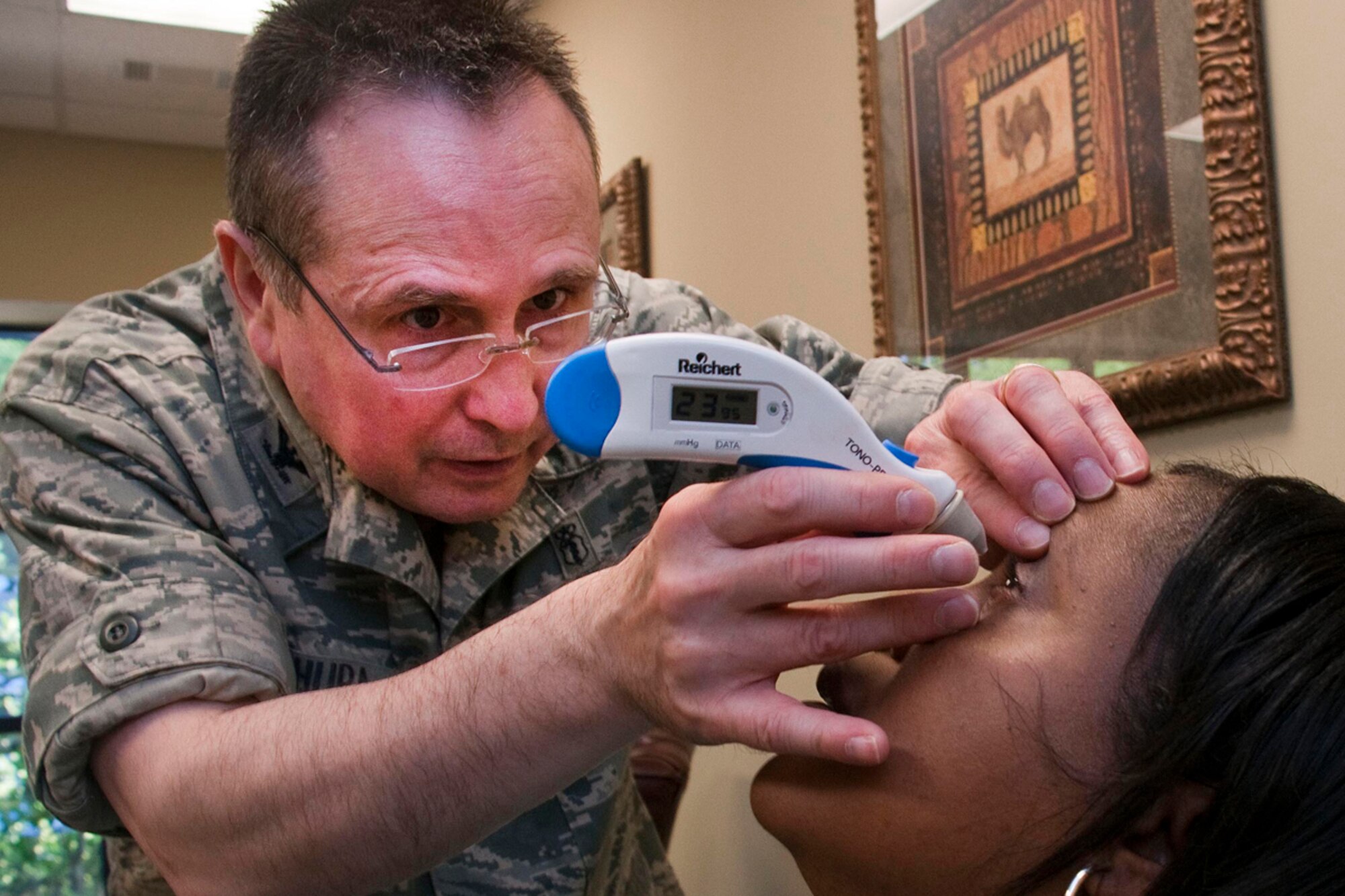 HAYNEVILLE, Ala. -- Air Force Col. Ron Kichura, an optometrist and commander of the Alaska Air National Guard?s 176th Medical Group, performs an inner ocular pressure test on Hayneville Mayor Helenore, Tuesday. (U.S. Air Force photo\Capt. John Callahan)