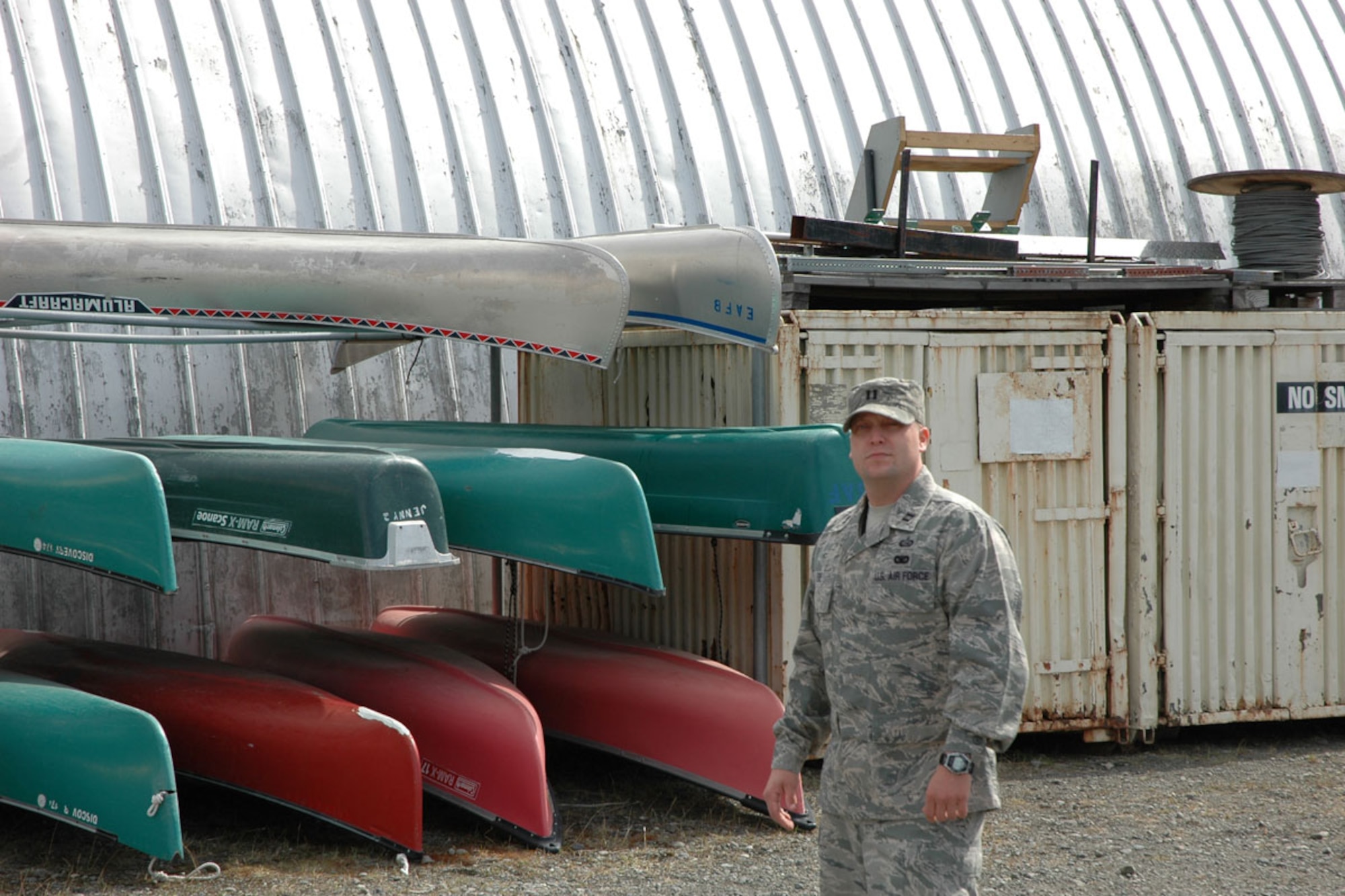 Air Force Capt. Michael Eide, 673d Force Support Squadron, pauses by a rack of rental canoes at Outdoor Recreation. Eide was choses as the Air Force’s Force Support Company Grade Officer of the Year. (U.S. Air Force photo\2nd Lt. Matthew Chism)