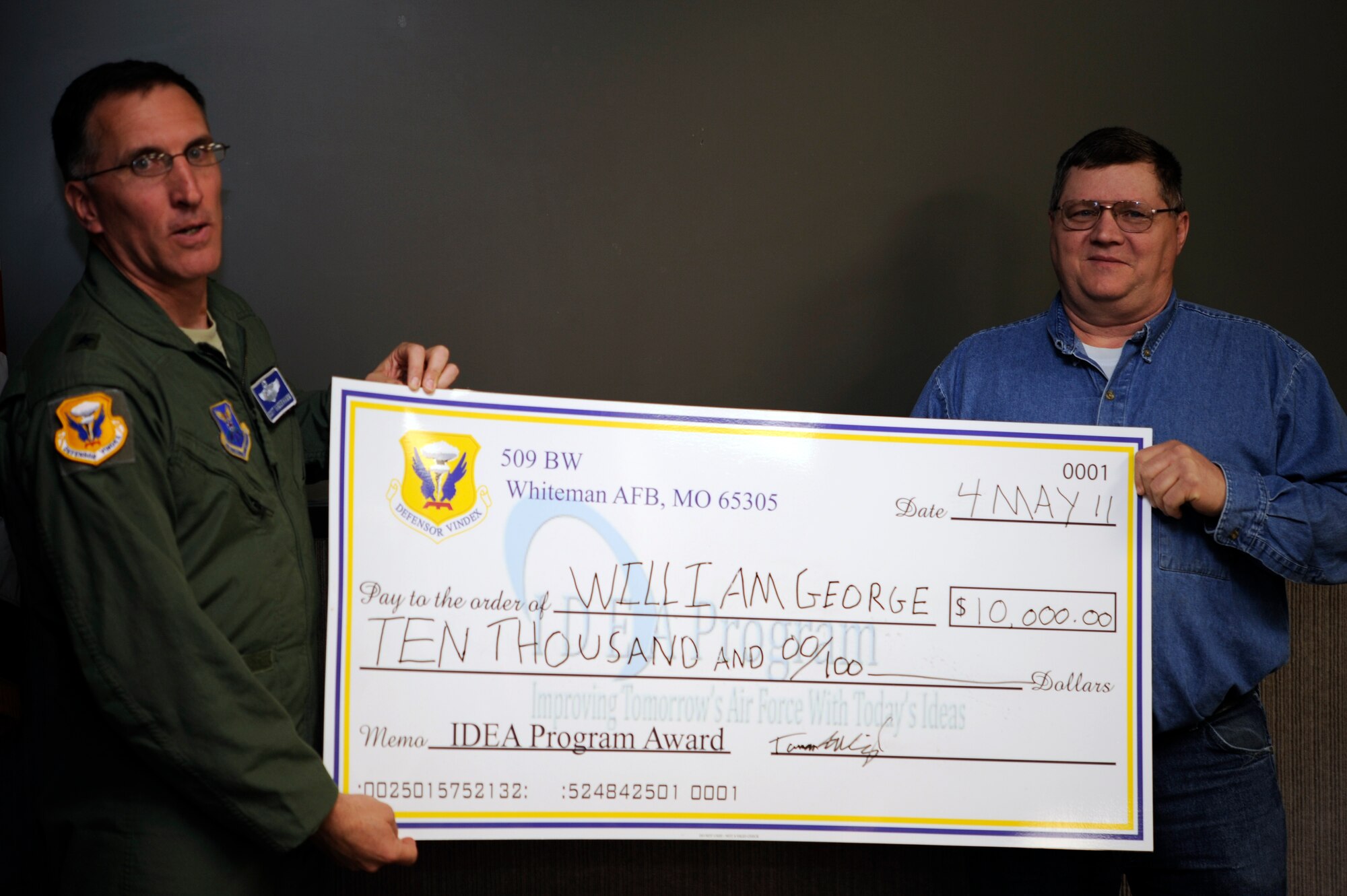 WHITEMAN AIR FORCE BASE, Mo. - William George, 509th Logistics Readiness Squadron vehicle repair and inspection technician, was presented $10,000 May 2 for his submission to the Innovative Development through Employee Awareness program here. (U.S. Air Force photo by Airman 1st Class Cody H. Ramirez) (Released) 
