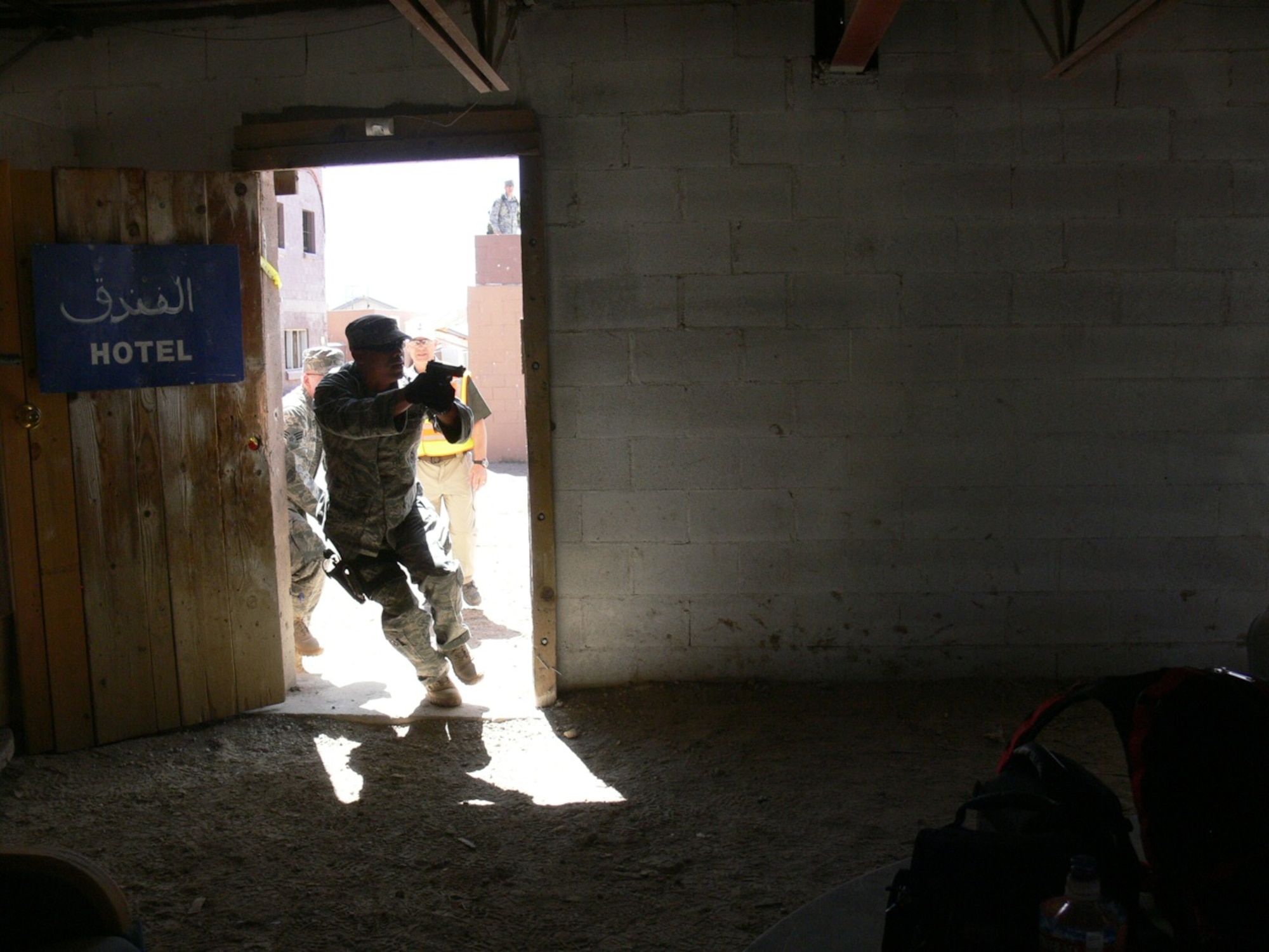An Airman enters a building during an Active Shooter Instructor Course May 2-5 at Fort Carson Army Installation’s Range 60. Airmen from the 21st Security Forces Squadron became certified active shooter instructors, along with 20 other active duty and Department of Defense police officers, after a five-day, 48-hour training course put on by a Washington-based private company. The 21st SFS certified active shooter instructors provide on-going training for the squadron. (U.S. Air Force photo/Monica Mendoza)