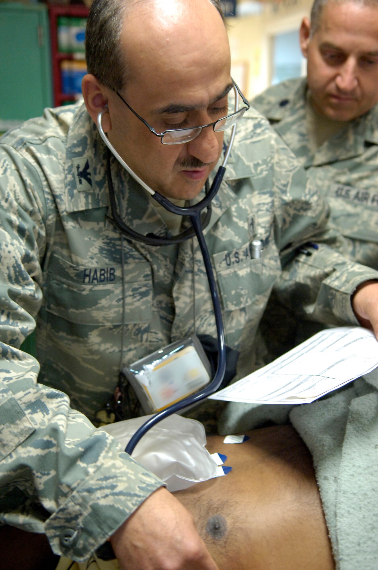 KIRKUK REGIONAL AIR BASE, Iraq – Col. Nabil Habib, 321st Expeditionary Medical Squadron general surgeon, checks a patient’s vital signs May 11. The 321st EMEDS is the principal surgical unit for American forces in all of northern Iraq, treating military and civilian patients alike. Colonel Habib, originally from Tampa, Fla., is deployed from Wright-Patterson Air Force Base, Ohio. (U.S. photo by Tech. Sgt. Randy Redman)