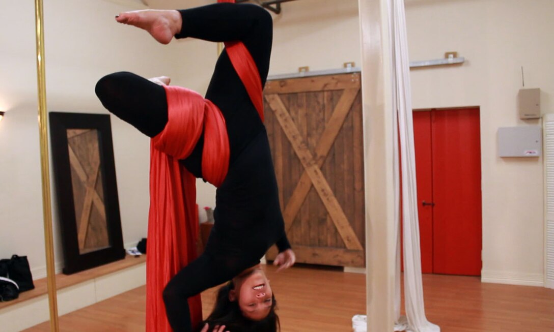 Tech. Sgt. Davina Wong, 419th Maintenance Squadron, practices her aerial silk routine. (Image from video by Tech. Sgt. Richard Gonzales)
