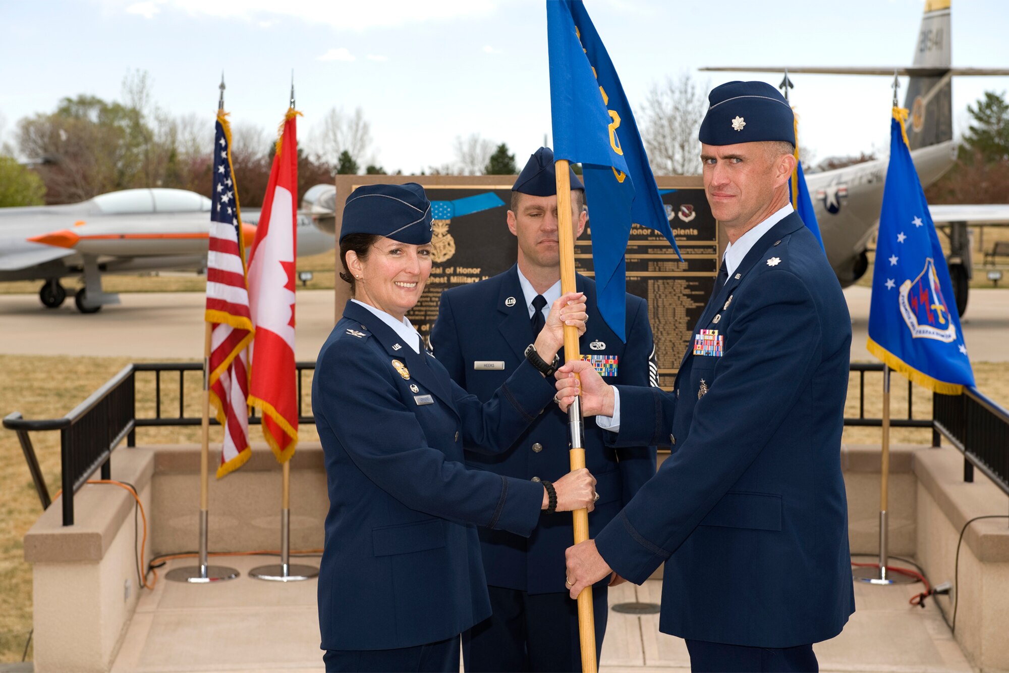 PETERSON AIR FORCE BASE, Colo. – Col. Nina Armagno, 21st Operations Group commander, passes the squadron colors to Lt. Col. Colin Connor, incoming 21st Operations Support Squadron commander, during the 21st OSS change of command ceremony May 4, 2011, at Medal of Honor Park on Peterson Air Force Base. Colonel Connor assumes command from Lt. Col. Troy Endicott. The 21st OSS “Rams” is made up of six flights and is responsible for providing mission support to Air Force Space Command’s worldwide network of attack warning, space surveillance and space communications units; supporting weather information requirements for Peterson Air Force Base, Schriever Air Force Base and Cheyenne Mountain Air Station; and, directing and coordinating base operations, all flightline activities and flight records management. (U.S. Air Force photo/Craig Denton)