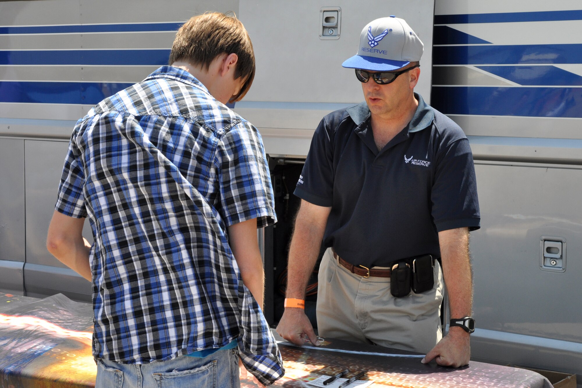 Master Sgt. Steven Bender, assistant senior recruiter, 307th Bomb Wing, talks with a possible Air Force candidate at the 2011 Defenders of Liberty Air Show at Barksdale Air Force Base, La., May 7, 2011. Both the 307th Bomb Wing and 917th Fighter Group provided static displays for the air show. (U.S. Air Force photo/Tech. Sgt. Jeff Walston)