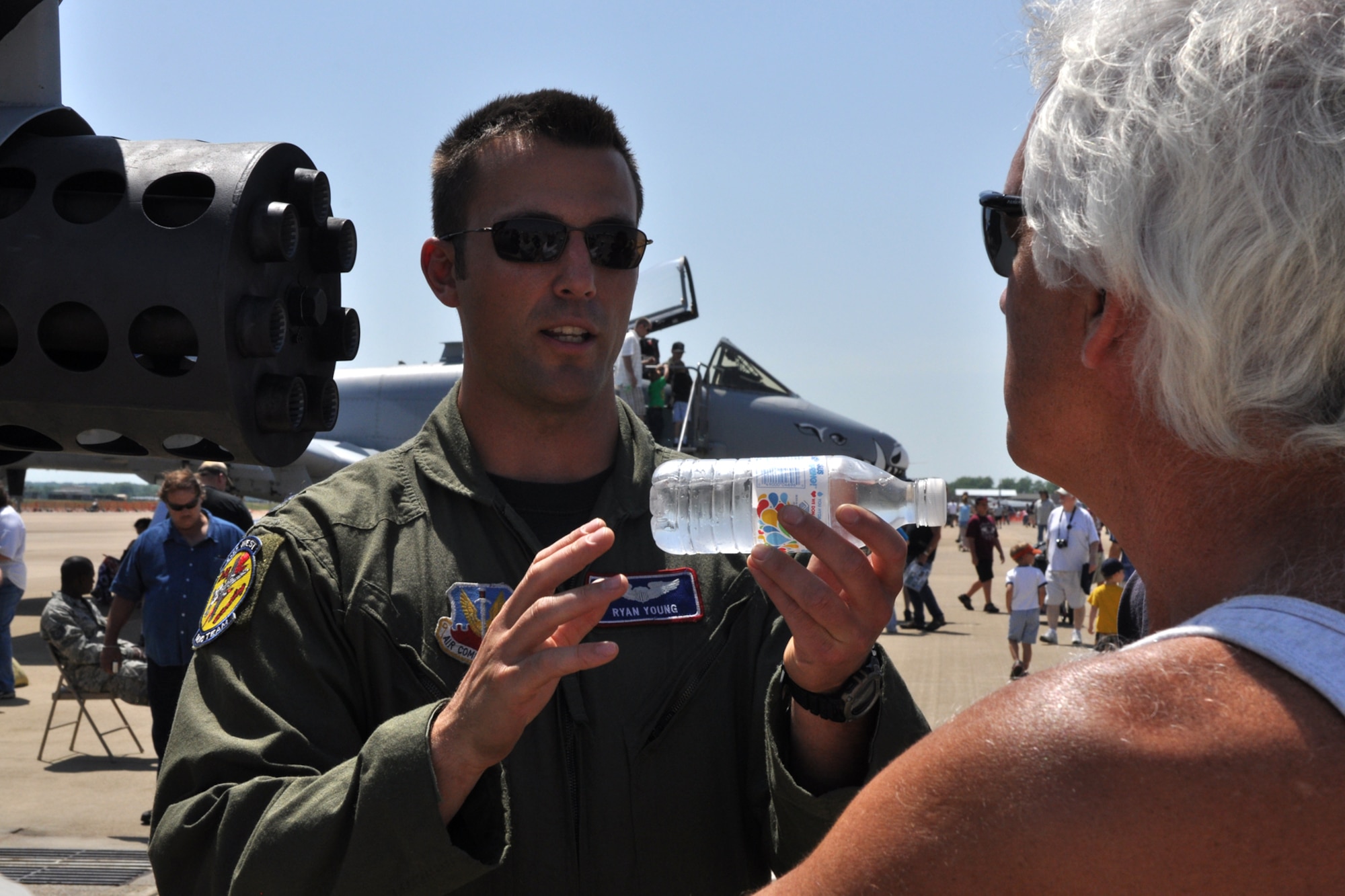 Capt. Ryan Young, a pilot assigned to the A-10 West Demonstration Team, from Davis-Monthan Air Force Base, briefs visitors at the 2011 Defenders of Liberty Air Show about the seven-barrel 30mm Gatling gun on an A-10 Thunderbolt II at Barksdale Air Force Base, La., May 7, 2011. Both the 307th Bomb Wing and 917th Fighter Group provided static displays for the air show. (U.S. Air Force photo/Tech. Sgt. Jeff Walston) 
