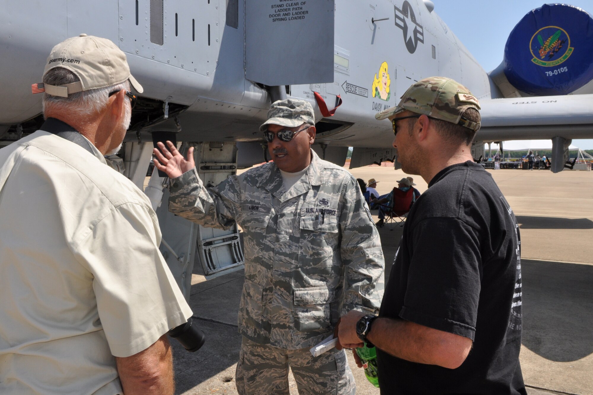 Master Sgt. Jose Limon, a weapons expediter assigned to the 917th Fighter Group, explains the seven-barrel 30mm Gatling gun on an A-10 Thunderbolt II to visitors at the 2011 Defenders of Liberty Air Show at Barksdale Air Force Base, La., May 7, 2011. The Warthog as it is affectionately known, has excellent maneuverability at low air speeds and altitude, and is a highly accurate weapons-delivery platform. Both the 307th Bomb Wing and 917th Fighter Group provided static displays for the air show. (U.S. Air Force photo/Tech. Sgt. Jeff Walston)
 
