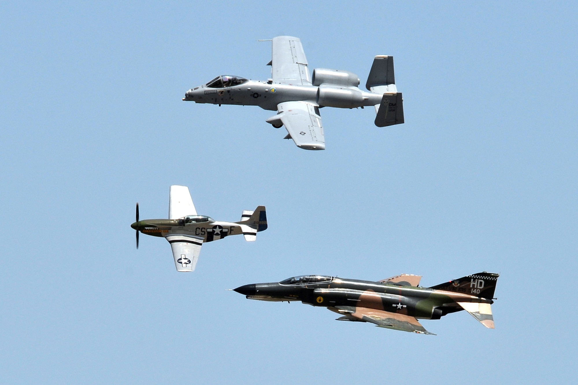 A Heritage Flight takes to the air in close formation at the 2011 Defenders of Liberty Air Show at Barksdale Air Force Base, La., May 7, 2011. The U.S. Air Force Heritage Flight (HF) program presents the evolution of USAF air power by flying today’s state-of-the-art fighter aircraft in close formation with vintage fighter aircraft. The air show HF consisted of a P-51 Mustang, an F-4 Phantom II and an A-10 Thunderbolt II. (U.S. Air Force photo/Tech. Sgt. Jeff Walston)

 
