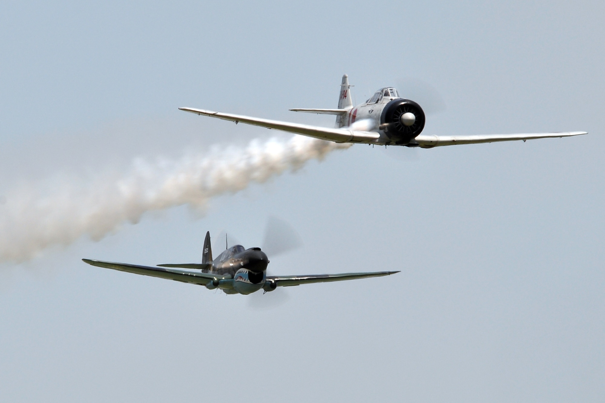 A P-40 Warhawk comes up on a Japanese aircraft’s six during the Commemorative Air Force’s “Tora, Tora, Tora,” a recreation of the 1941 attack on Pearl Harbor at the 2011 Defenders of Liberty Air Show at Barksdale Air Force Base, La., May 7, 2011. Designed as a living history lesson, “Tora, Tora, Tora” is intended as a memorial to all the soldiers on both sides who gave their lives for their countries. Both the 307th Bomb Wing and 917th Fighter Group provided static displays for the air show. (U.S. Air Force photo/Tech. Sgt. Jeff Walston)