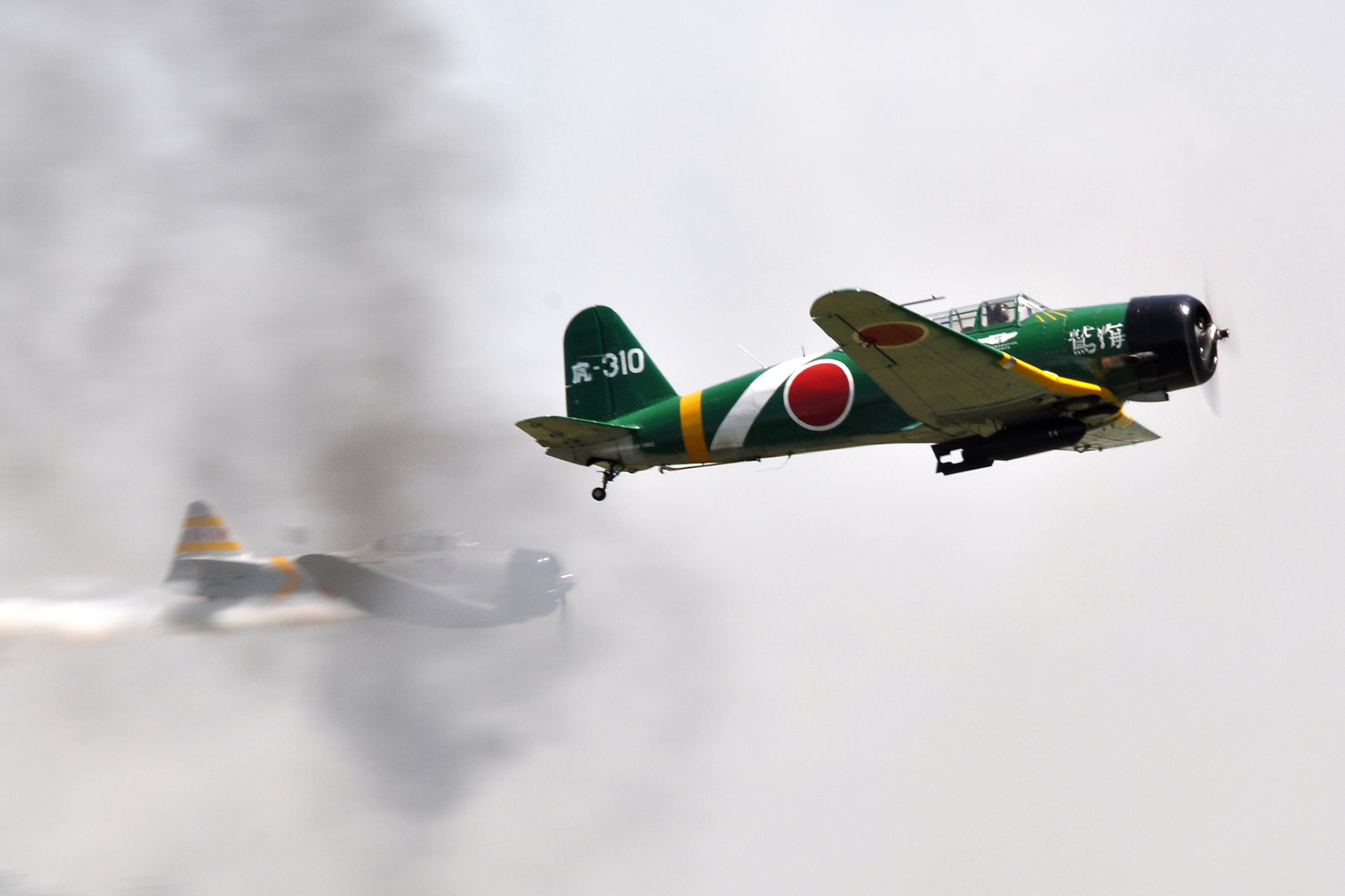 Replica Japanese aircraft from the Commemorative Air Force’s “Tora, Tora, Tora” performance, recreate the 1941 attack on Pearl Harbor at the 2011 Defenders of Liberty Air Show at Barksdale Air Force Base, La., May 7, 2011. Designed as a living history lesson, “Tora, Tora, Tora” is intended as a memorial to all the soldiers on both sides who gave their lives for their countries. Both the 307th Bomb Wing and 917th Fighter Group provided static displays for the air show. (U.S. Air Force photo/Tech. Sgt. Jeff Walston)