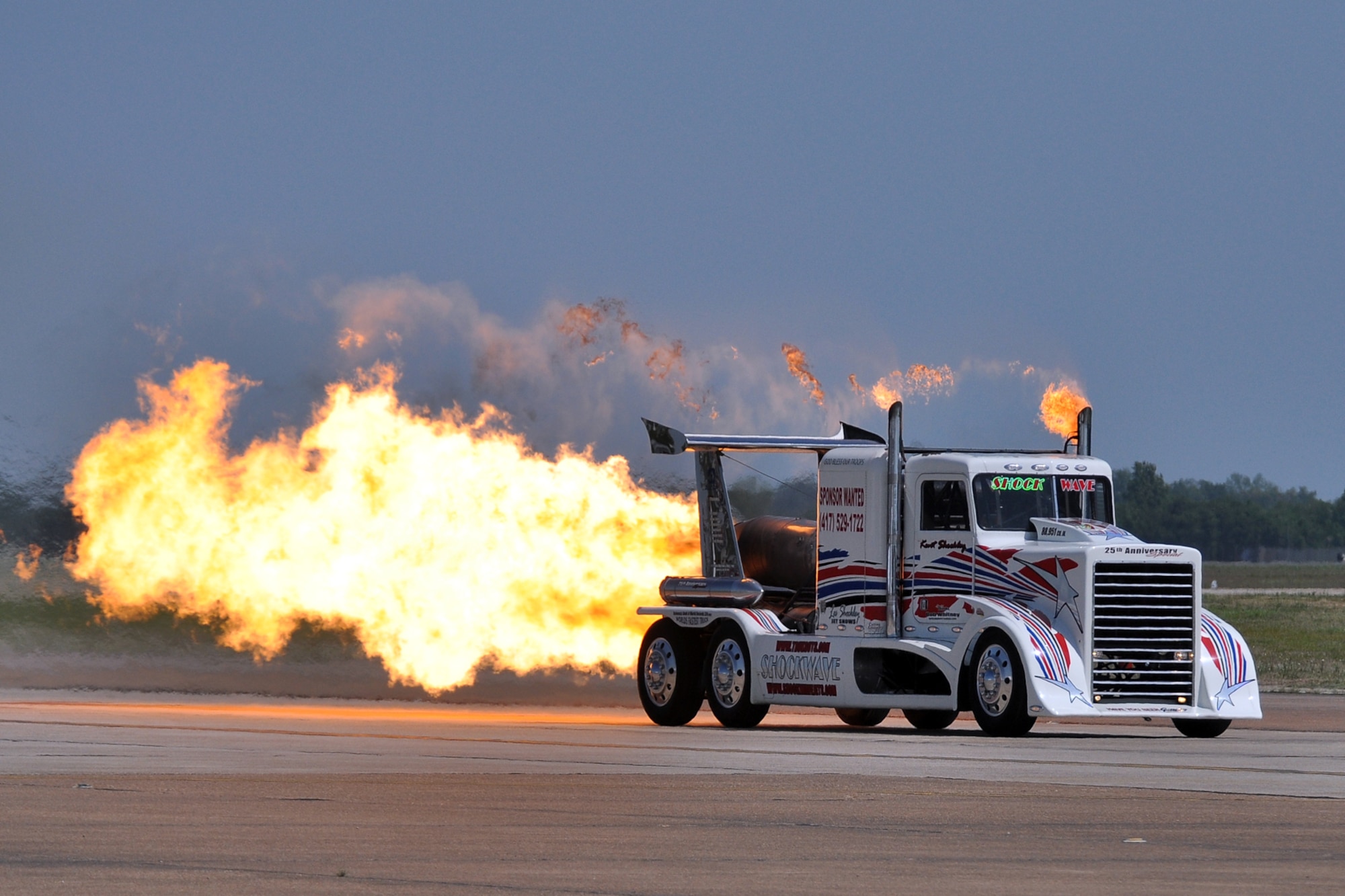 Ray Kinney driving his P-40 Shockwave Jet Truck heats up the 2011 Defenders of Liberty Air Show at Barksdale Air Force Base, La., May 7, 2011. A Louisiana State Trooper clocked the jet truck at 306 mph during its first demonstration of the air show. Both the 307th Bomb Wing and 917th Fighter Group provided static displays for the air show. (U.S. Air Force photo/Tech. Sgt. Jeff Walston)