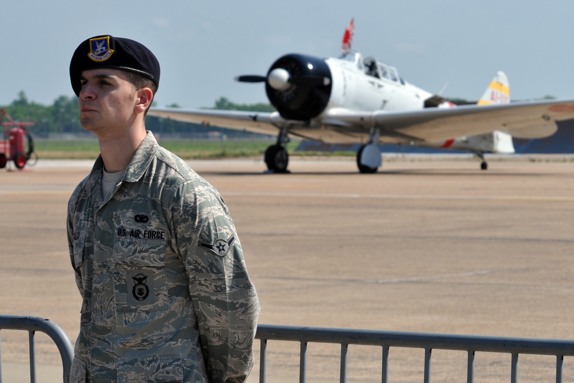 Airman Joseph Gallo, a patrolman with 2nd Security Forces Squadron, stands watch over a section of perimeter fencing at the 2011 Defenders of Liberty Air Show at Barksdale Air Force Base, La., May 7, 2011. Both the 307th Bomb Wing and 917th Fighter Group provided static displays for the air show. (U.S. Air Force photo/Tech. Sgt. Jeff Walston)