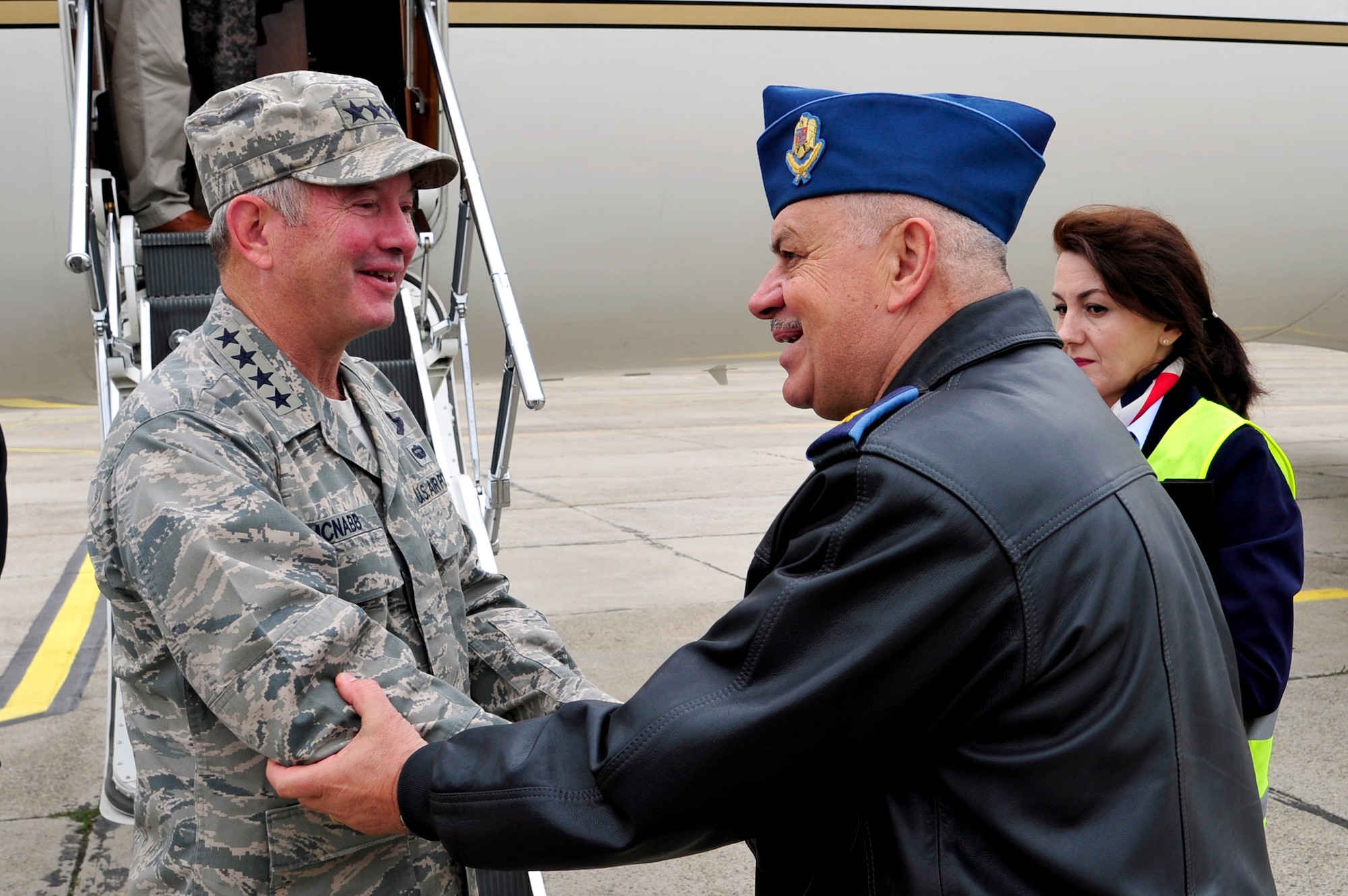Gen. Duncan McNabb, U.S. Transportation Command commander is greeted by Brig. Gen. Costel Tataru, Romanian air force deputy chief of logistics at Mihail Kogalniceanu Air Base, Romania, during a visit there May 12. While in Romania, General McNabb visited both Mihail Kogalniceanu airport and the Port of Constanta.  USTRANSCOM is evaluating the feasibility of using the airport and seaport as a multi-modal hub for equipment flowing into and out of the U.S. Central Command theater of operation.  (U.S. Air Force photo by Master Sgt. Laura K. Deckman/released)