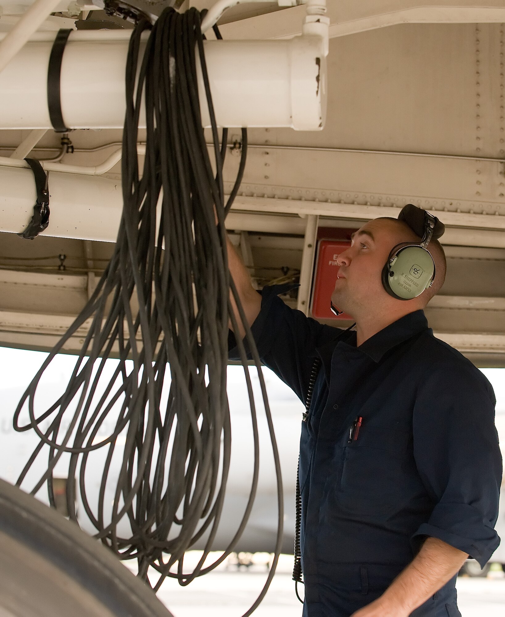 Staff Sgt. Rob Sheppard, 436th Aircraft Maintenance Squadron flying crew chief, inspects the hydraulic system of a C-5B Galaxy’s wheel well May 12, 2011, at Dover Air Force Base, Del. The Airman of the 436 AMXS maintain all C-5 Galaxys and Super Galaxys in the 436th Airlift Wing’s inventory.  (U.S. Air Force photo by Airman 1st Class Jacob Morgan)