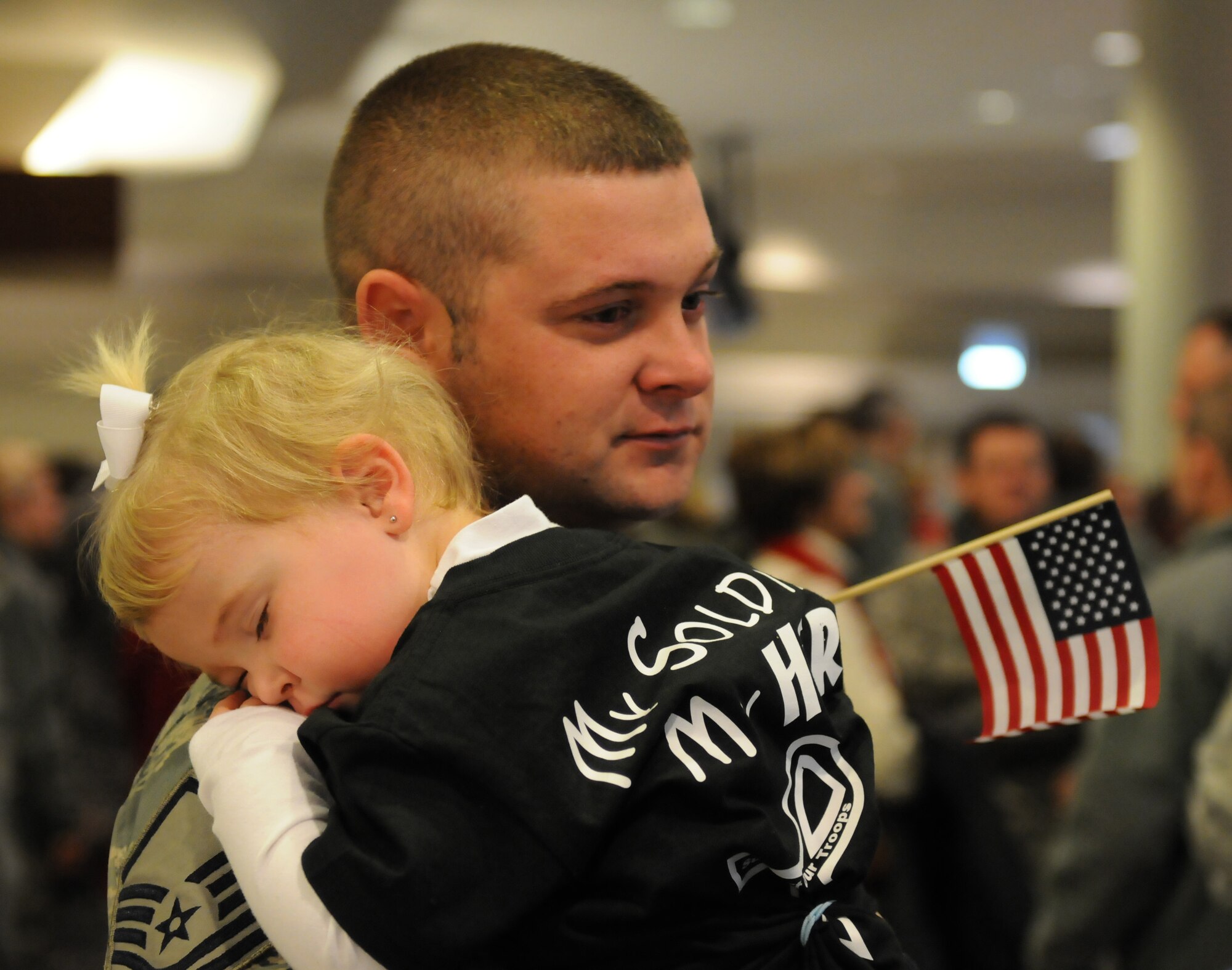 Master Sgt. Shaun Cecil, Kentucky Air National Guard 123d Civil Engineers Squadron Airman, hugs a loved one before deploying in support on December 8, 2010.  The Airmen will be supporting airbase operations at an undisclosed location during a six-month tour of duty.  (U.S. Air Force photo by Tech. Sgt. Dennis Flora)