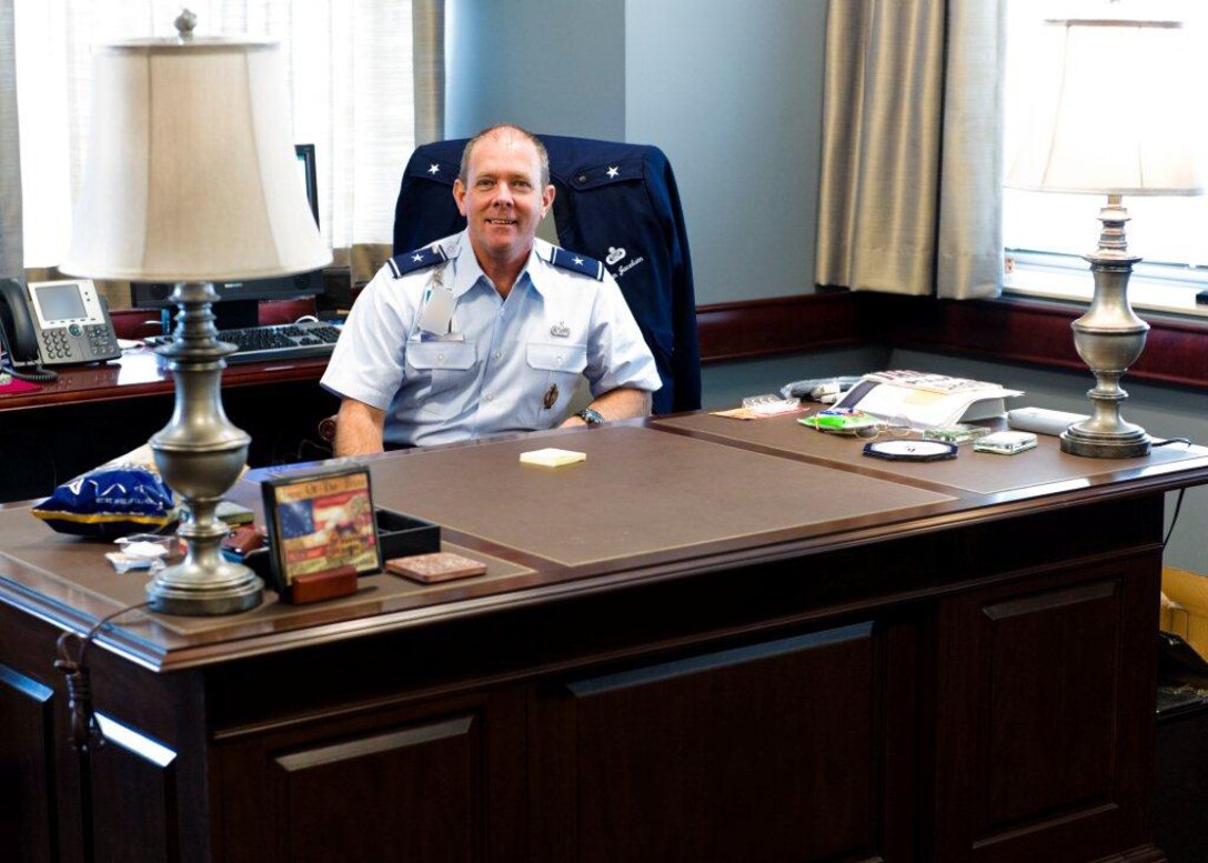 Brig, Gen. Kevin Jacobsen, AFOSI commander, sits at his new desk at AFOSI's new headquarters at Marine Corps Base Quantico, Va. The BRAC 2005 mandate requires that five sovereign federal investigative agencies relocate and co-locate in the new facility at Quantico by Sept. 15, 2011.  AFOSI officially began the move into the new headquarters April 18, ahead of schedule. (Air Force Photo.)
